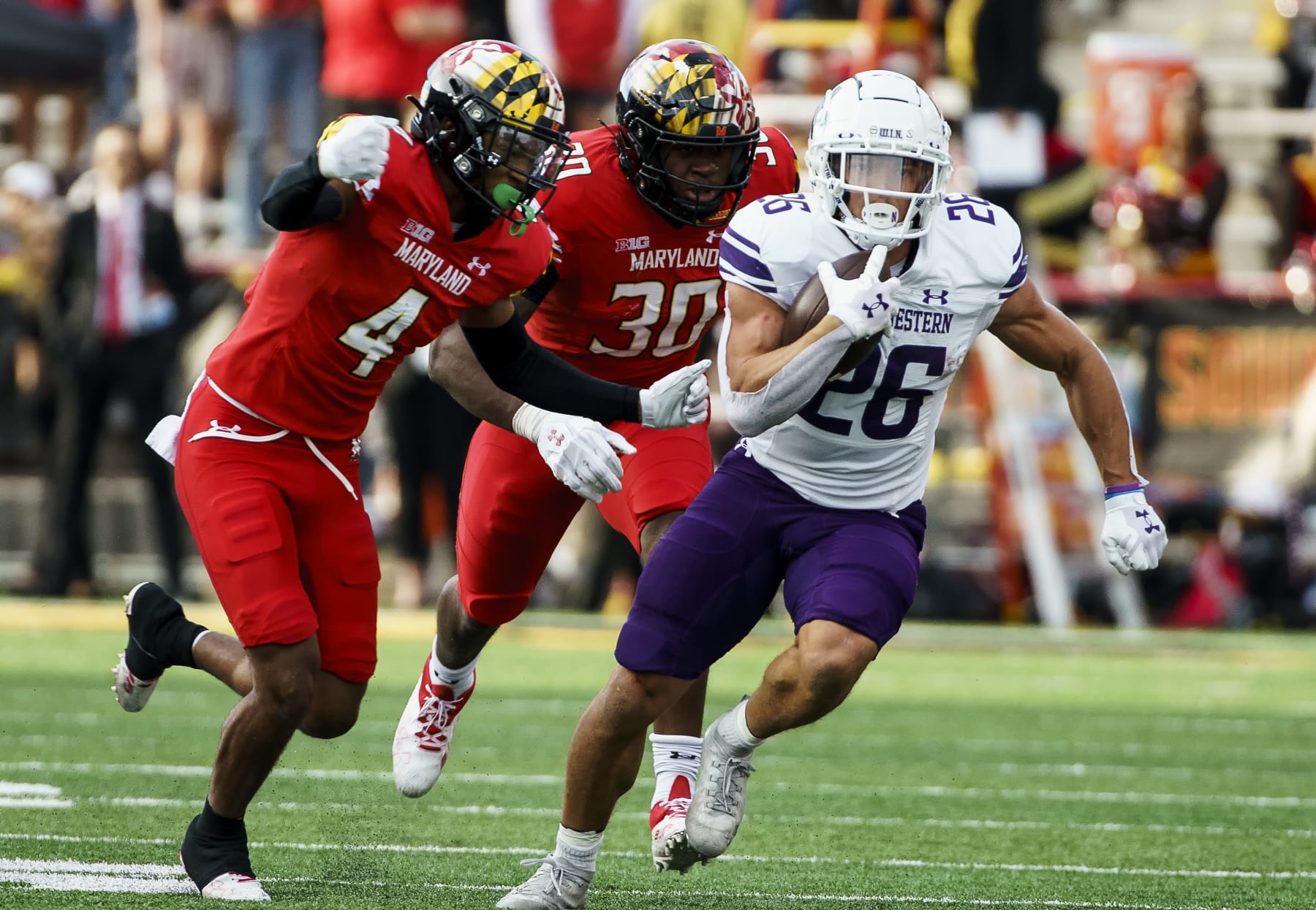 COLLEGE PARK, MD - OCTOBER 22:  Maryland Terrapins defensive back Tarheeb Still (4) and defensive back Caleb Atogho (30)chase down Northwestern Wildcats running back Evan Hull (26) during a Big10 football game between the Maryland Terrapins and the Northwestern Wildcats, on October 22, 2022, at Secu Stadium, in College Park, Maryland.
(Photo by Tony Quinn/Icon Sportswire via Getty Images)