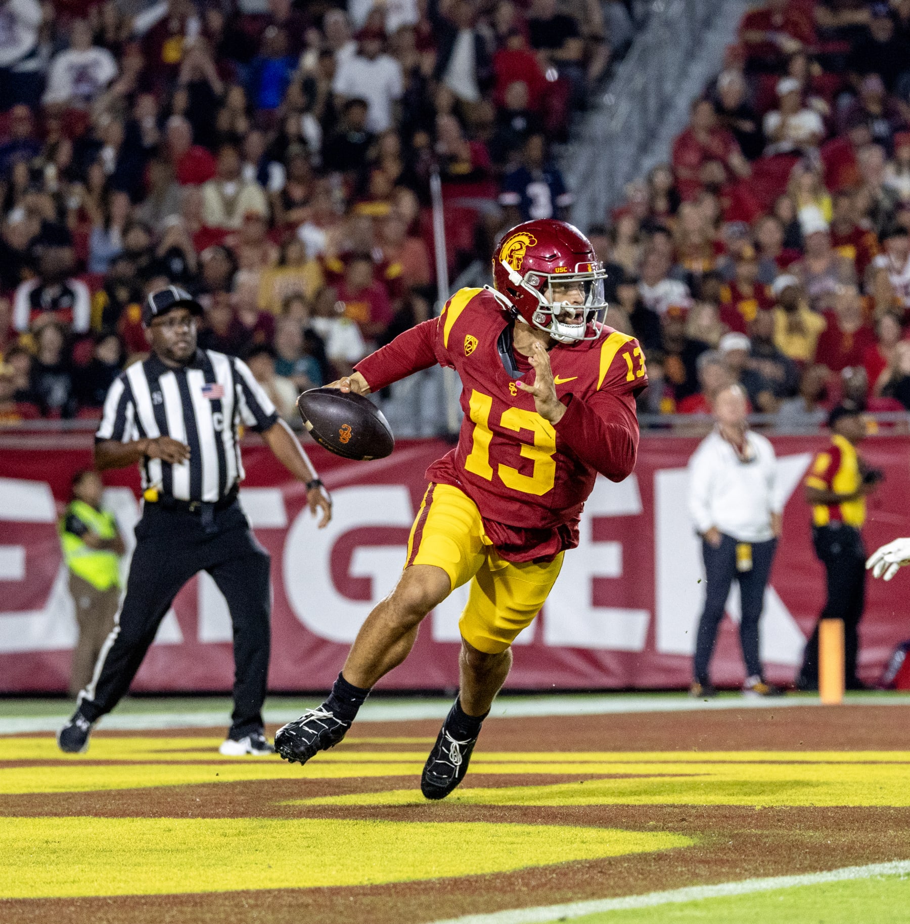 LOS ANGELES, CA  - OCTOBER 7, 2023: USC Trojans quarterback Caleb Williams (13 )scrambles out of the pocket against Arizona  at the LA Memorial Coliseum on October 7, 2023 in Los Angeles, California.(Gina Ferazzi / Los Angeles Times via Getty Images)