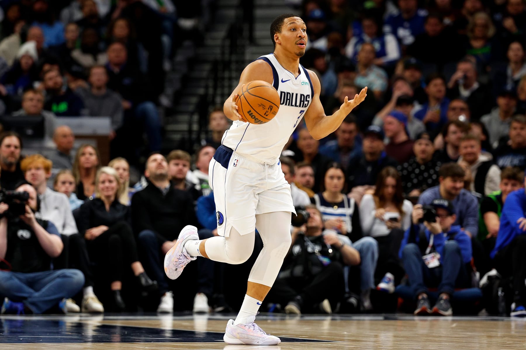MINNEAPOLIS, MINNESOTA - DECEMBER 28: Grant Williams #3 of the Dallas Mavericks dribbles the ball against the Minnesota Timberwolves in the third quarter at Target Center on December 28, 2023 in Minneapolis, Minnesota. The Timberwolves defeated the Mavericks 118-110. NOTE TO USER: User expressly acknowledges and agrees that, by downloading and or using this photograph, User is consenting to the terms and conditions of the Getty Images License Agreement. (Photo by David Berding/Getty Images)