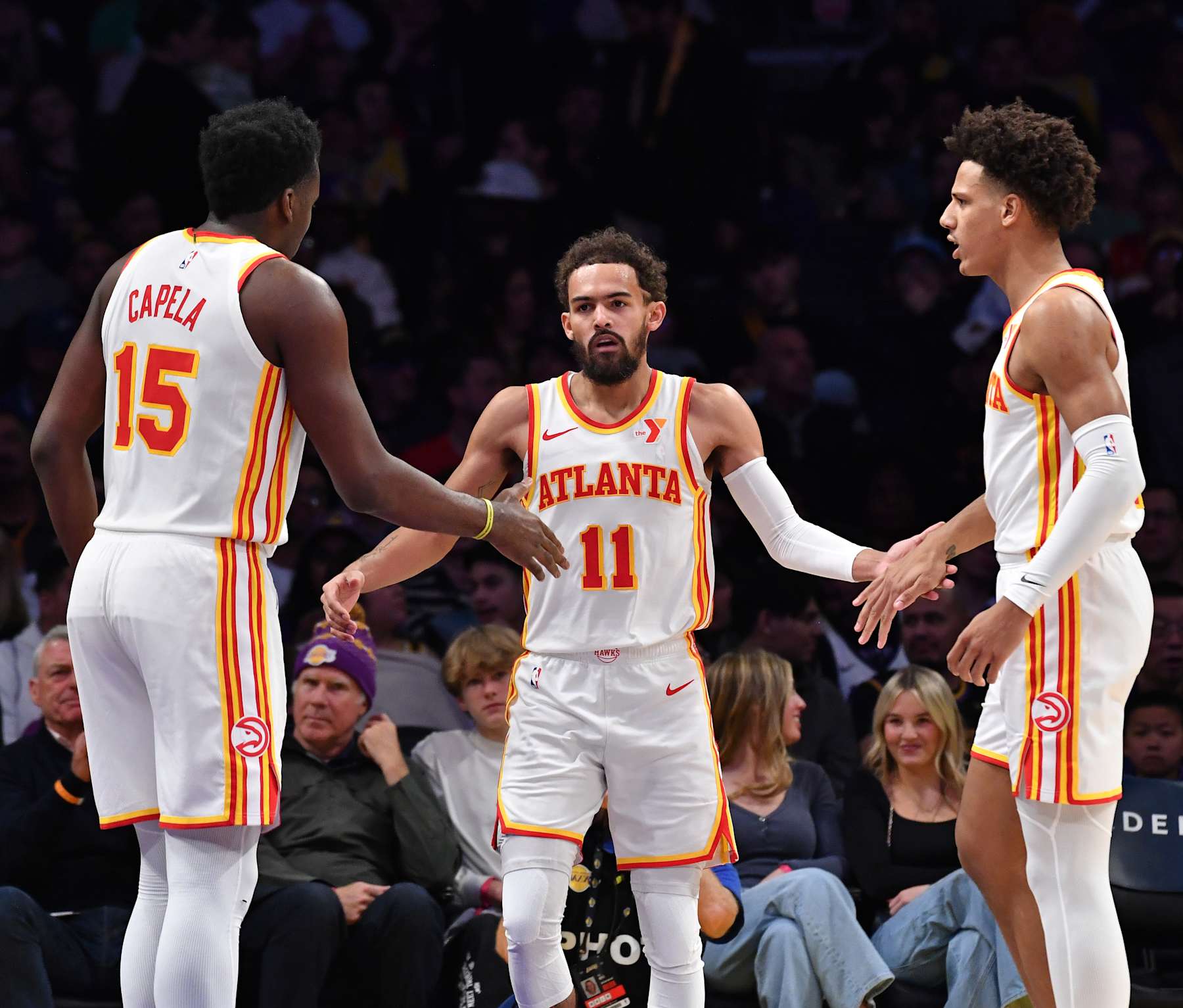 LOS ANGELES, CA - JANUARY 3: Clint Capela #15, Trae Young #11 and Jalen Johnson #1 of the Atlanta Hawks looks on during the game against the Los Angeles Lakers on January 3, 2025 at Crypto.Com Arena in Los Angeles, California. NOTE TO USER: User expressly acknowledges and agrees that, by downloading and/or using this Photograph, user is consenting to the terms and conditions of the Getty Images License Agreement. Mandatory Copyright Notice: Copyright 2025 NBAE (Photo by Juan Ocampo/NBAE via Getty Images)