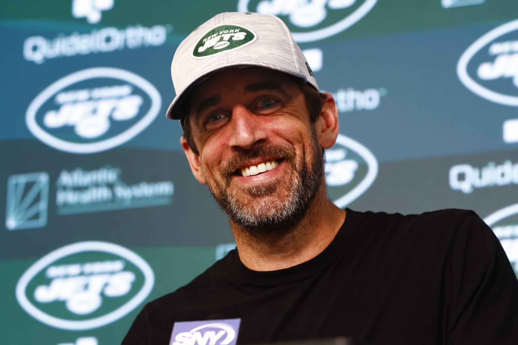 FLORHAM PARK, NEW JERSEY - JUNE 9: Quarterback Aaron Rodgers #8 of the New York Jets talks to reporters after the team's OTA's at Atlantic Health Jets Training Center on June 9, 2023 in Florham Park, New Jersey. (Photo by Rich Schultz/Getty Images)