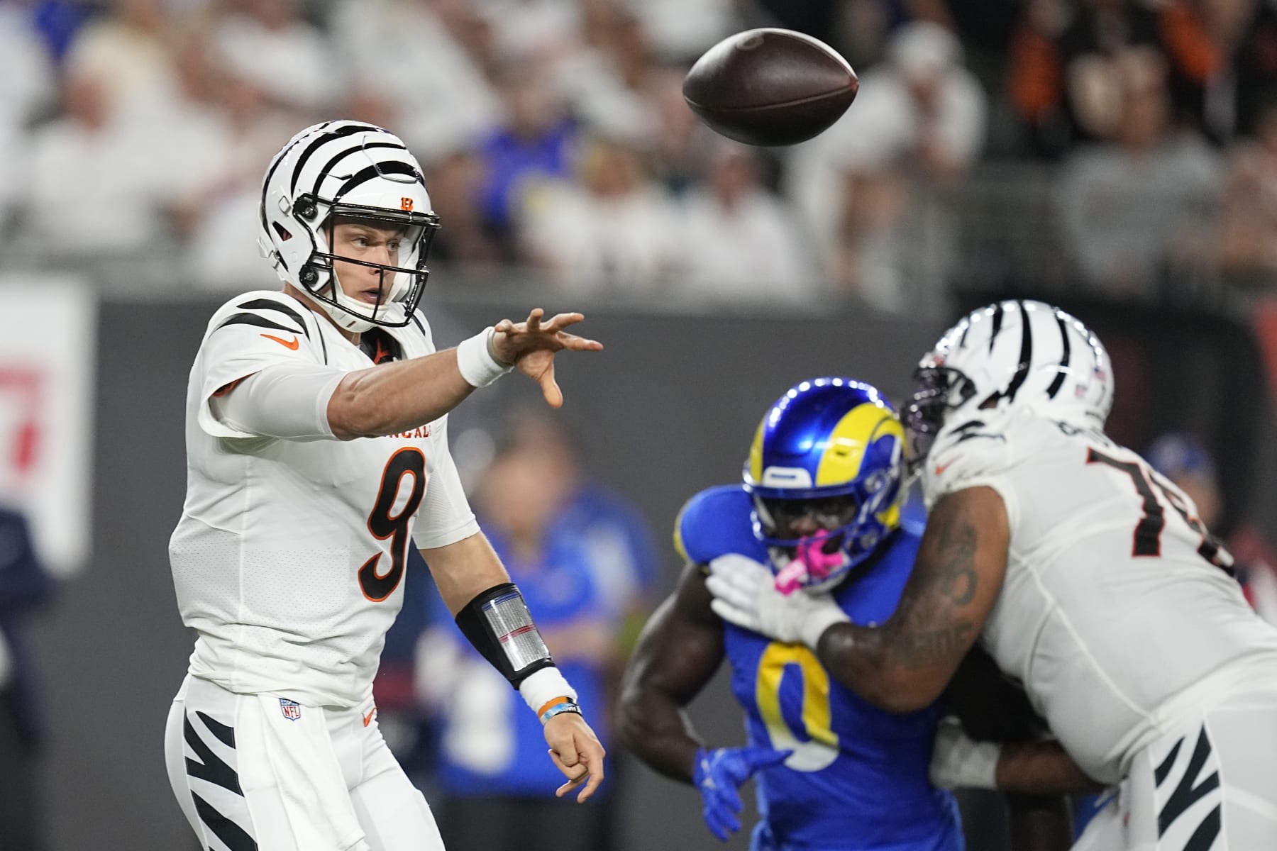 Cincinnati Bengals quarterback Joe Burrow (9) throws during the first half of an NFL football game against the Los Angeles Rams Monday, Sept. 25, 2023, in Cincinnati. (AP Photo/Darron Cummings)