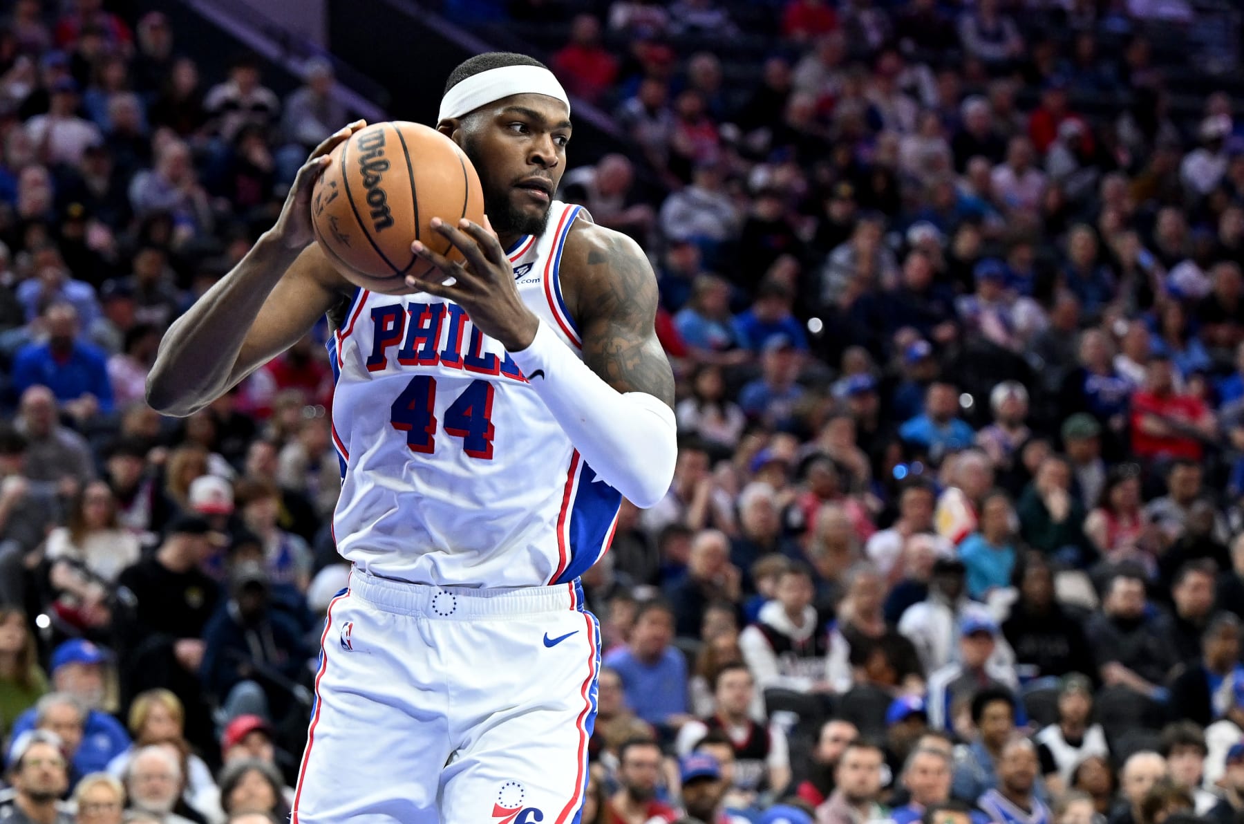 PHILADELPHIA, PENNSYLVANIA - APRIL 14: Paul Reed #44 of the Philadelphia 76ers grabs a rebound against the Brooklyn Nets at the Wells Fargo Center on April 14, 2024 in Philadelphia, Pennsylvania.  NOTE TO USER: User expressly acknowledges and agrees that, by downloading and or using this photograph, User is consenting to the terms and conditions of the Getty Images License Agreement. (Photo by G Fiume/Getty Images)