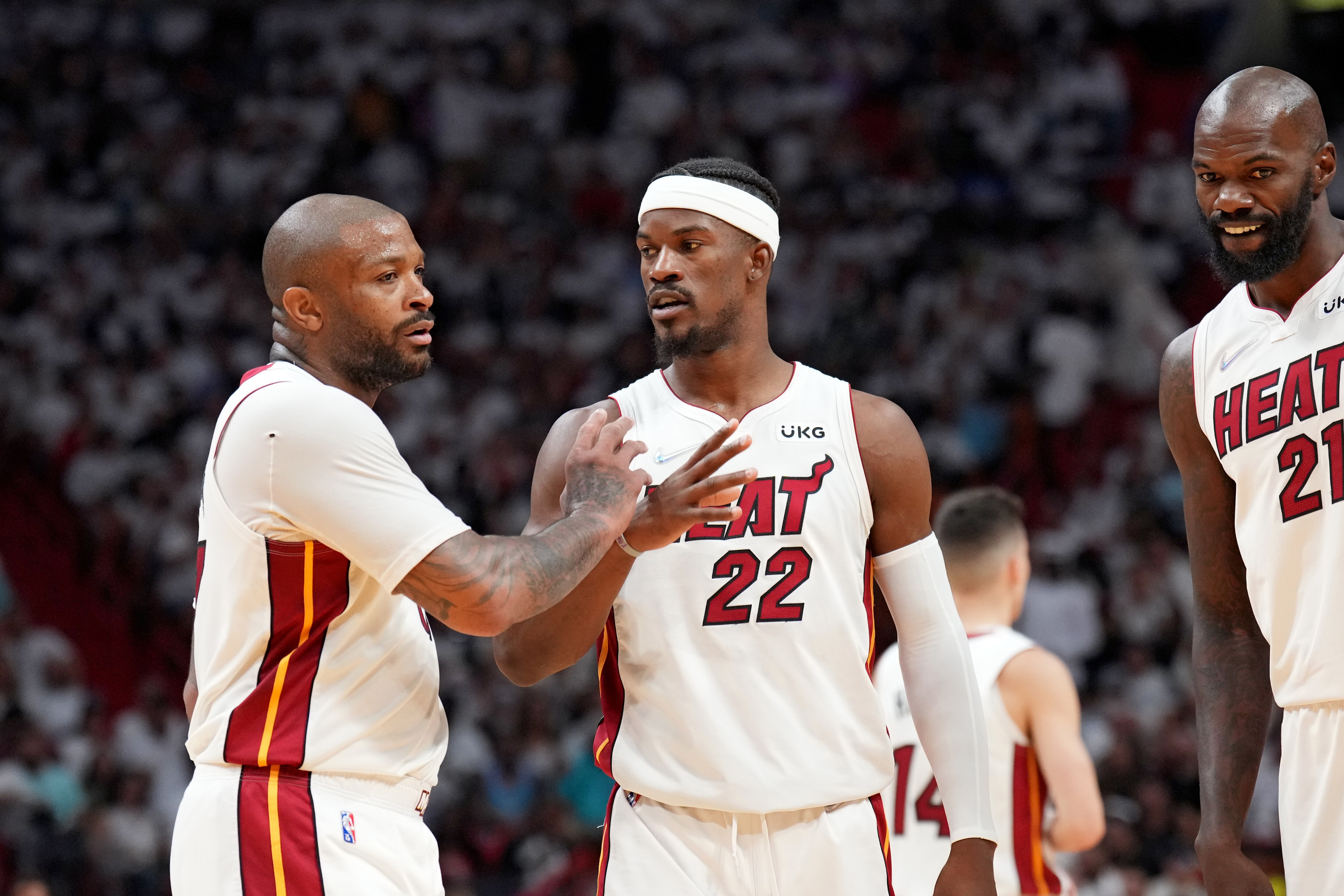 MIAMI, FL - MAY 4: P.J. Tucker #17 of the Miami Heat and Jimmy Butler #22 of the Miami Heat high-five during Game 2 of the 2022 NBA Playoffs Eastern Conference Semifinals on May 4, 2022 at The FTX Arena in Miami, Florida. NOTE TO USER: User expressly acknowledges and agrees that, by downloading and/or using this Photograph, user is consenting to the terms and conditions of the Getty Images License Agreement. Mandatory Copyright Notice: Copyright 2022 NBAE (Photo by Jesse D. Garrabrant/NBAE via Getty Images)