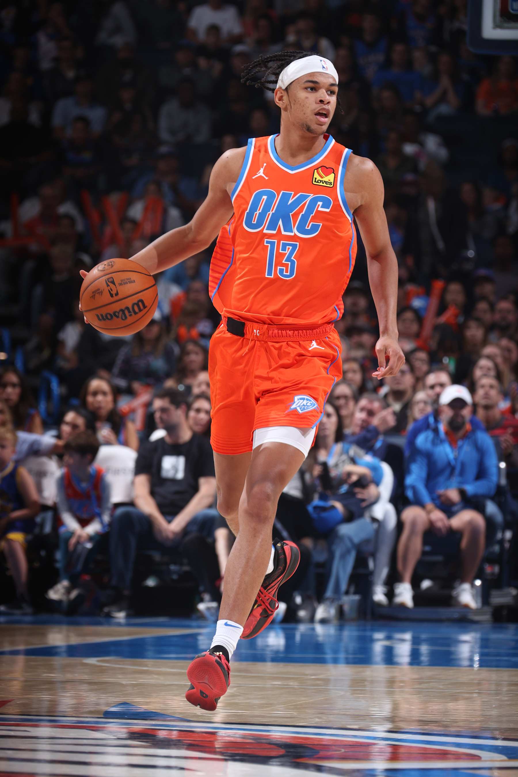 OKLAHOMA CITY, OK - NOVEMBER 10: Ousmane Dieng #13 of the Oklahoma City Thunder dribbles the ball during the game against the Golden State Warriors on November 10, 2024 at Paycom Center in Oklahoma City, Oklahoma. NOTE TO USER: User expressly acknowledges and agrees that, by downloading and or using this photograph, User is consenting to the terms and conditions of the Getty Images License Agreement. Mandatory Copyright Notice: Copyright 2024 NBAE (Photo by Nathaniel S. Butler/NBAE via Getty Images)