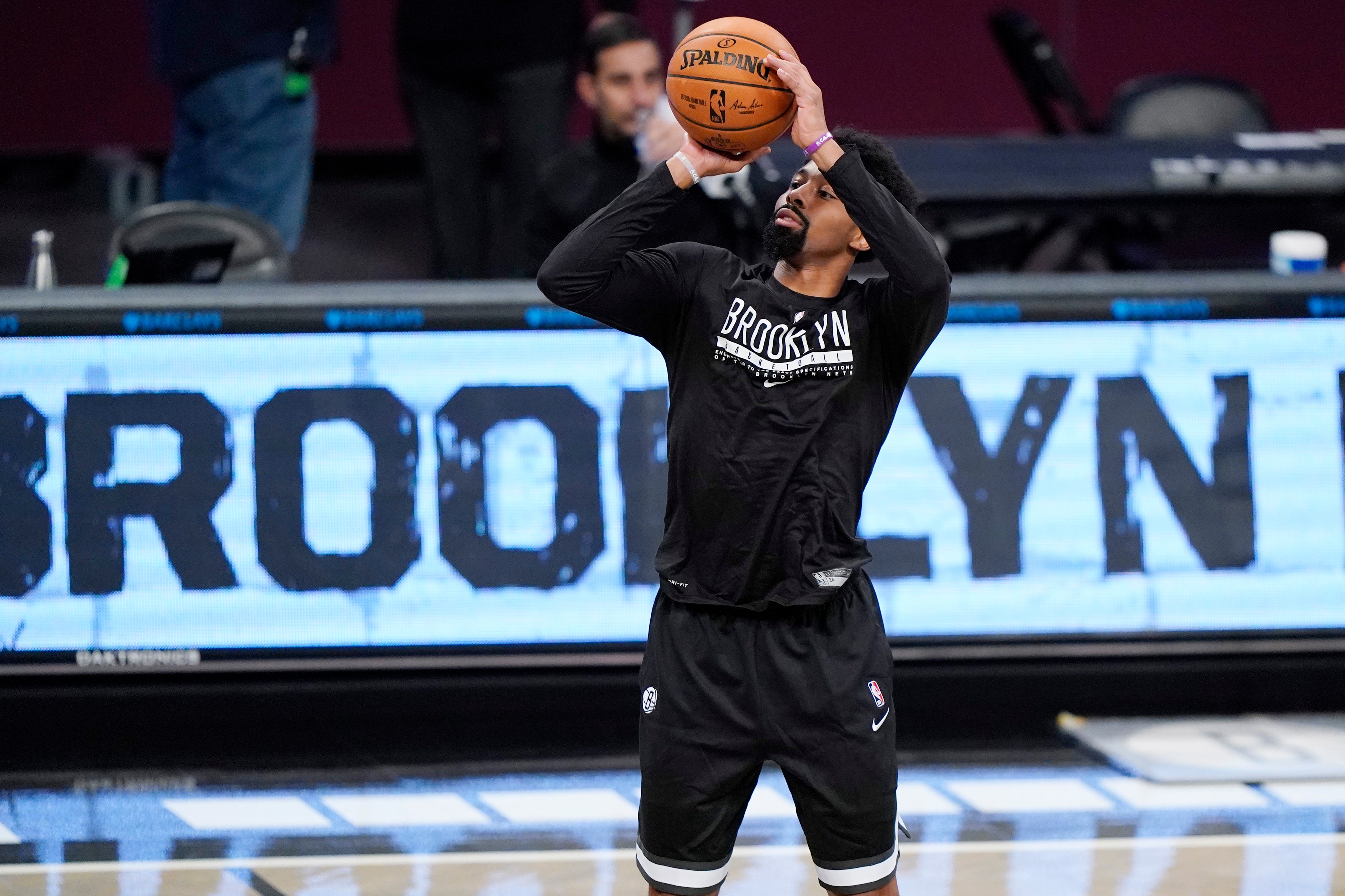 Brooklyn Nets guard Spencer Dinwiddie warms up before the start of a preseason NBA basketball game against the Washington Wizards, Sunday, Dec. 13, 2020, in New York. (AP Photo/Kathy Willens)
