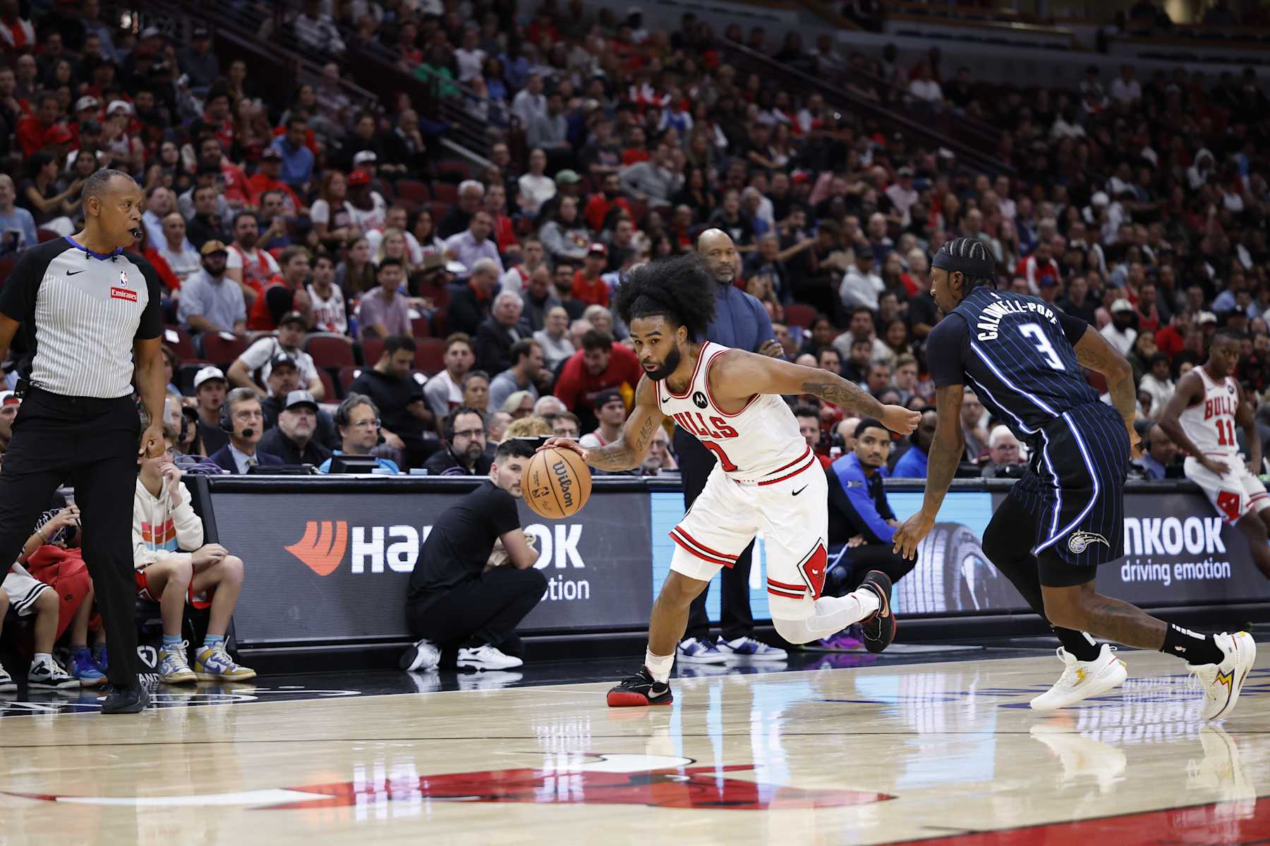 CHICAGO, IL - OCTOBER 30: Coby White #0 of the Chicago Bulls drives to the basket during the game against the Orlando Magic on October 30, 2024 at United Center in Chicago, Illinois. NOTE TO USER: User expressly acknowledges and agrees that, by downloading and or using this photograph, User is consenting to the terms and conditions of the Getty Images License Agreement. Mandatory Copyright Notice: Copyright 2024 NBAE (Photo by Kamil Krzaczynski/NBAE via Getty Images)