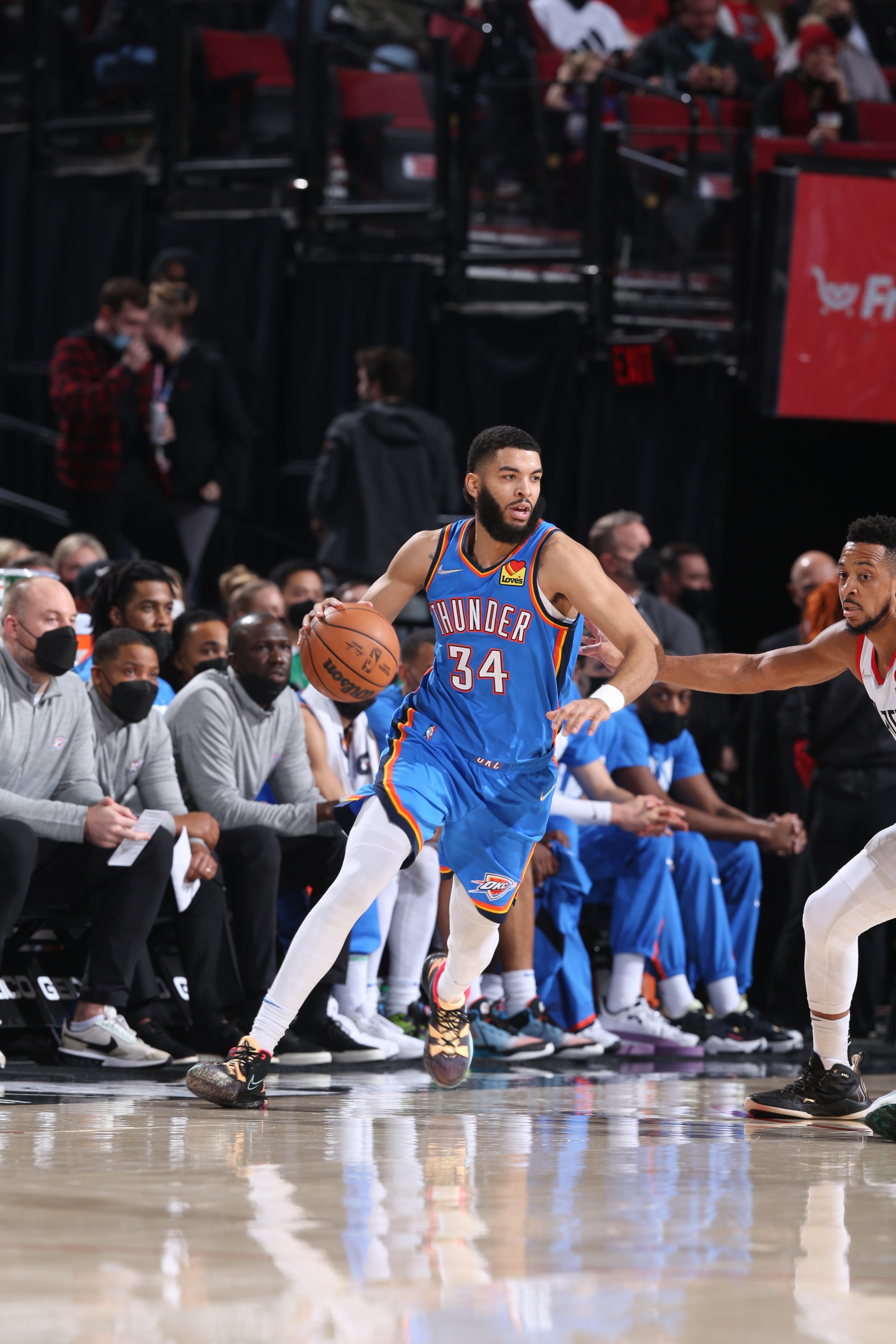 PORTLAND, OR - FEBRUARY 4: Kenrich Williams #34 of the Oklahoma City Thunder dribbles the ball during the game against the Portland Trail Blazers on February 4, 2022 at the Moda Center Arena in Portland, Oregon. NOTE TO USER: User expressly acknowledges and agrees that, by downloading and or using this photograph, user is consenting to the terms and conditions of the Getty Images License Agreement. Mandatory Copyright Notice: Copyright 2022 NBAE (Photo by Sam Forencich/NBAE via Getty Images)
