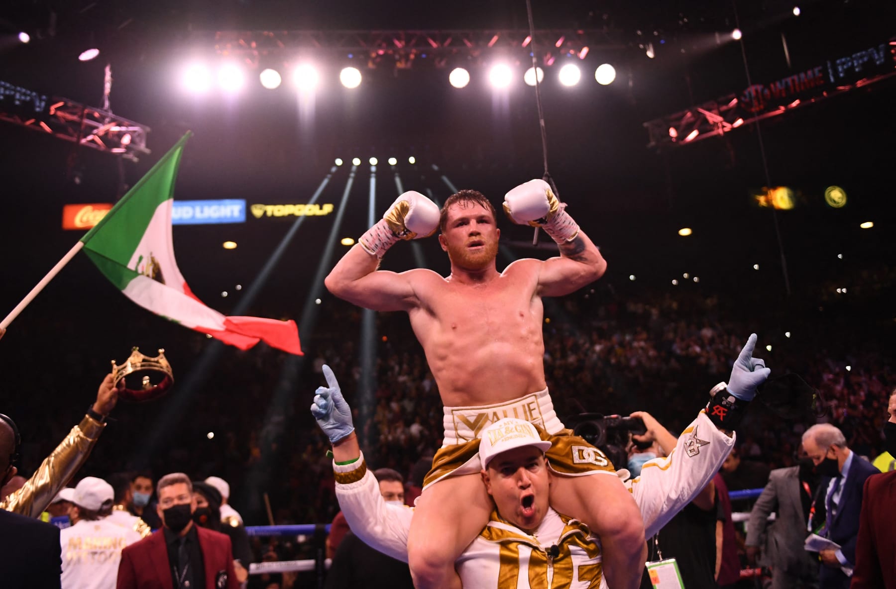 Canelo Alvarez of Mexico celebrates his 11th round TKO win over Caleb Plant of the United States (off frame) during their super-middleweight unification boxing match at MGM Garden Arena in Las Vegas, Nevada on November 6, 2021. (Photo by Patrick T. FALLON / AFP) (Photo by PATRICK T. FALLON/AFP via Getty Images)