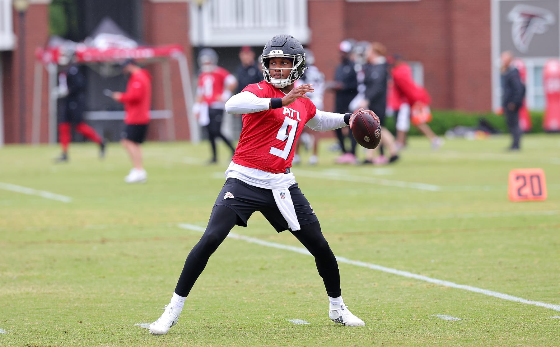 FLOWERY BRANCH, GEORGIA - MAY 14:  Quarterback Michael Penix Jr. #9 of the Atlanta Falcons looks to pass during OTA offseason workouts at the Atlanta Falcons training facility on May 14, 2024 in Flowery Branch, Georgia. (Photo by Kevin C. Cox/Getty Images)
