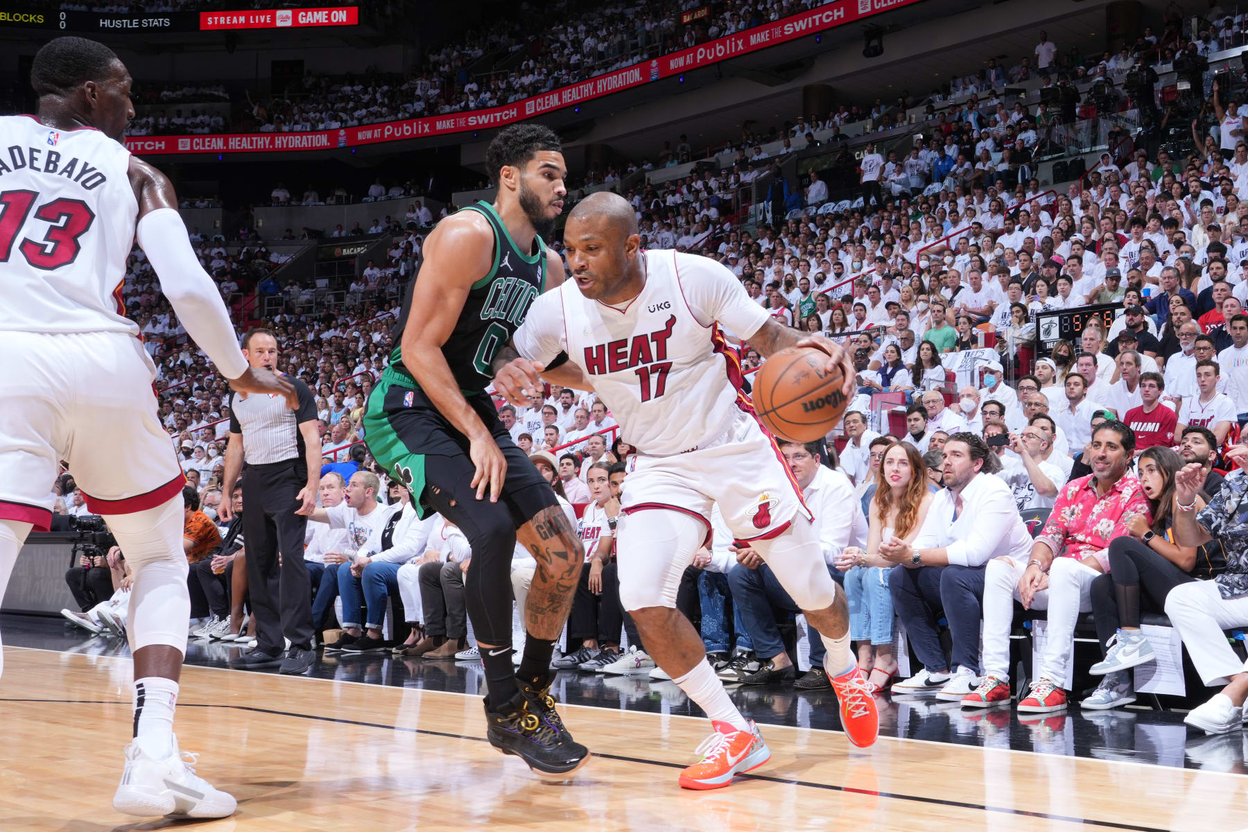 MIAMI, FL - MAY 25: P.J. Tucker #17 of the Miami Heat handles the ball against Jayson Tatum #0 of the Boston Celtics during Game 5 of the 2022 NBA Playoffs Eastern Conference Finals on May 25, 2022 at The FTX Arena in Miami, Florida. NOTE TO USER: User expressly acknowledges and agrees that, by downloading and/or using this Photograph, user is consenting to the terms and conditions of the Getty Images License Agreement. Mandatory Copyright Notice: Copyright 2022 NBAE (Photo by Jesse D. Garrabrant/NBAE via Getty Images)