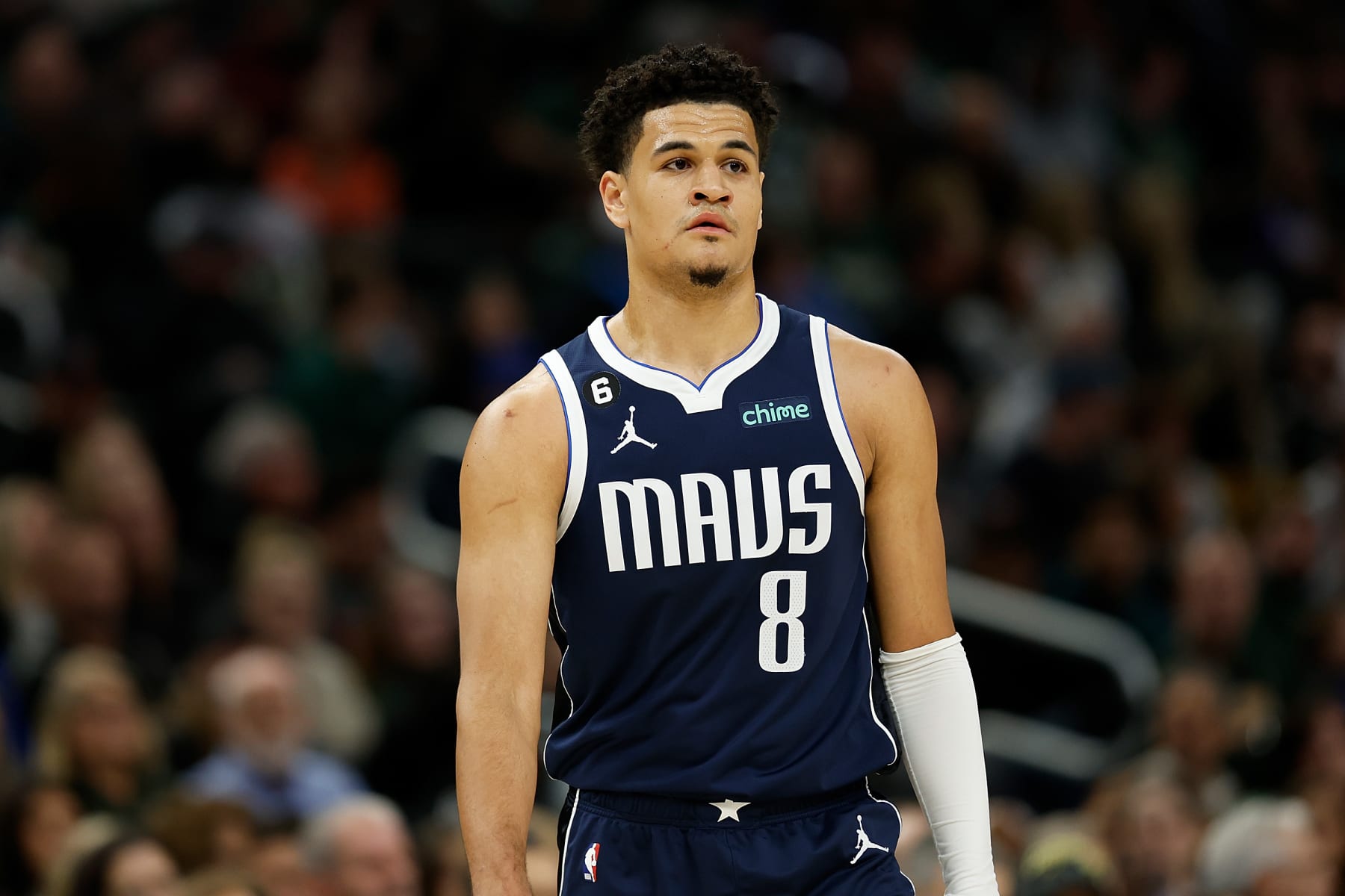 MILWAUKEE, WISCONSIN - NOVEMBER 27: Josh Green #8 of the Dallas Mavericks looks on during the first half of the game against the Milwaukee Bucks at Fiserv Forum on November 27, 2022 in Milwaukee, Wisconsin. NOTE TO USER: User expressly acknowledges and agrees that, by downloading and or using this photograph, User is consenting to the terms and conditions of the Getty Images License Agreement. (Photo by John Fisher/Getty Images)