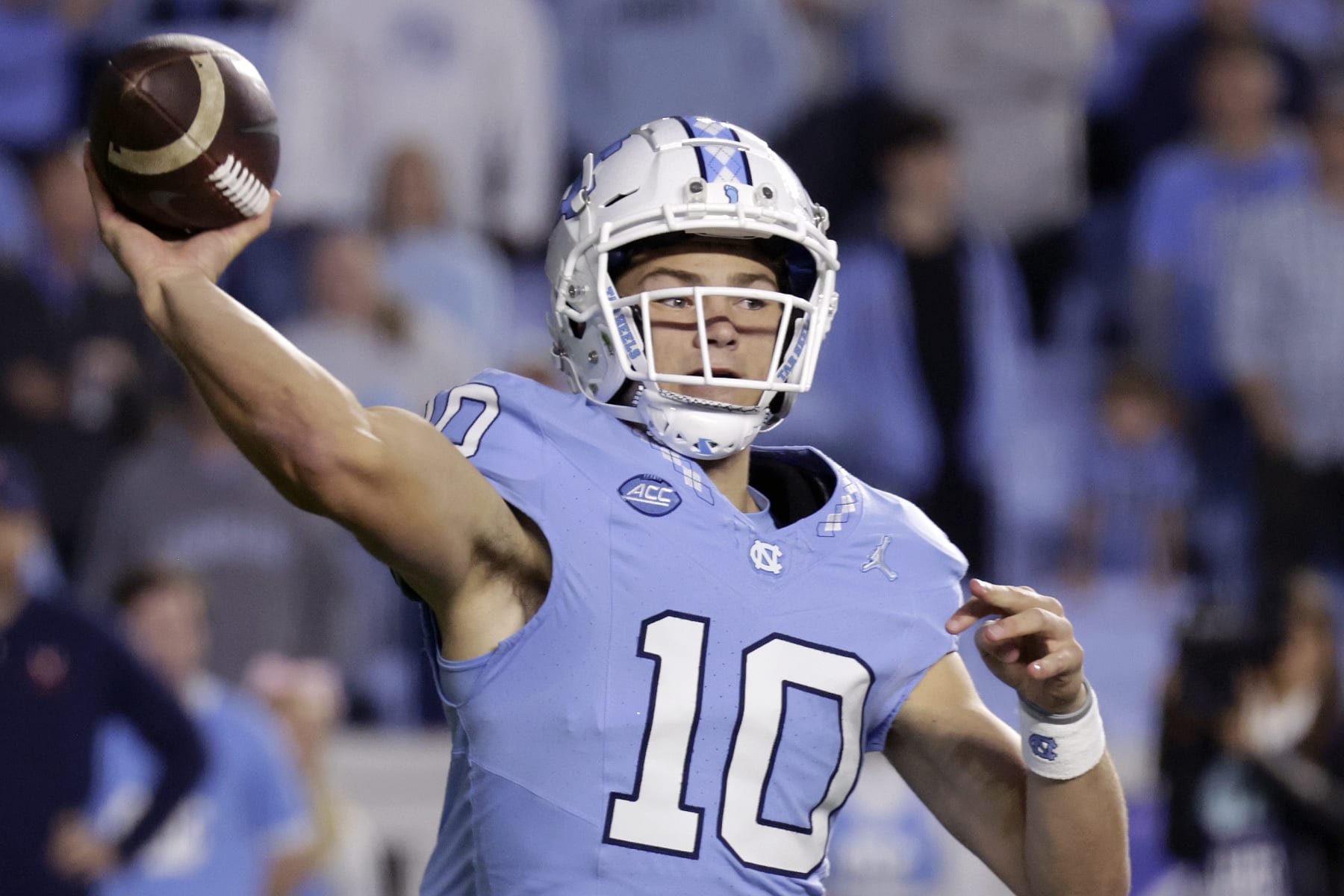 North Carolina quarterback Drake Maye (10) passes during the first half of an NCAA college football game against Virginia, Saturday, Oct. 21, 2023, in Chapel Hill, N.C. (AP Photo/Chris Seward)