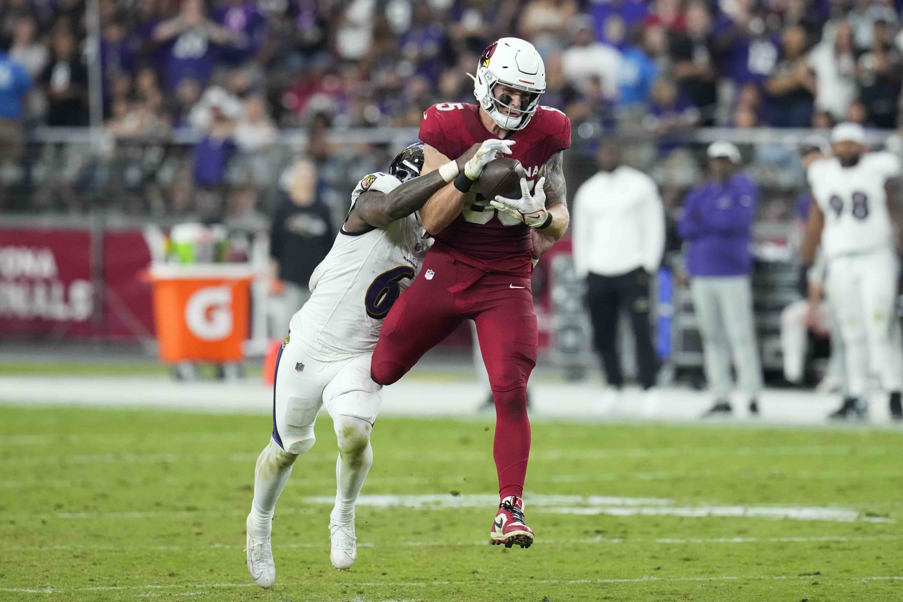 Arizona Cardinals tight end Trey McBride (85) makes a catch against Baltimore Ravens linebacker Patrick Queen (6) during the second half of an NFL football game Sunday, Oct. 29, 2023, in Glendale, Ariz. (AP Photo/Ross D. Franklin)