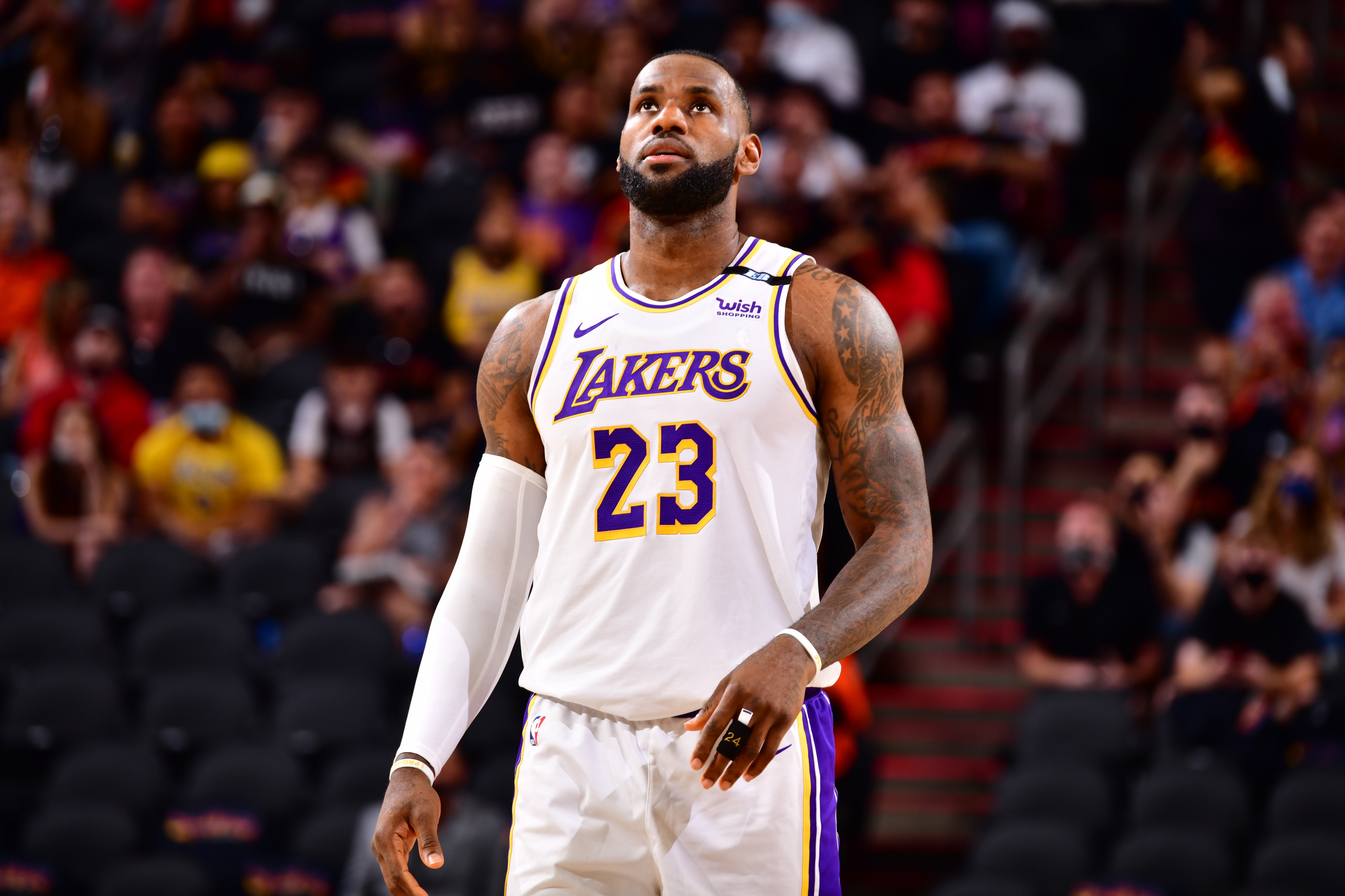 PHOENIX, AZ - MAY 23: LeBron James #23 of the Los Angeles Lakers looks on during the game against the Phoenix Suns during Round 1, Game 1 of the 2021 NBA Playoffs on May 23, 2021 at Talking Stick Resort Arena in Phoenix, Arizona. NOTE TO USER: User expressly acknowledges and agrees that, by downloading and or using this photograph, user is consenting to the terms and conditions of the Getty Images License Agreement. Mandatory Copyright Notice: Copyright 2021 NBAE (Photo by Barry Gossage/NBAE via Getty Images)