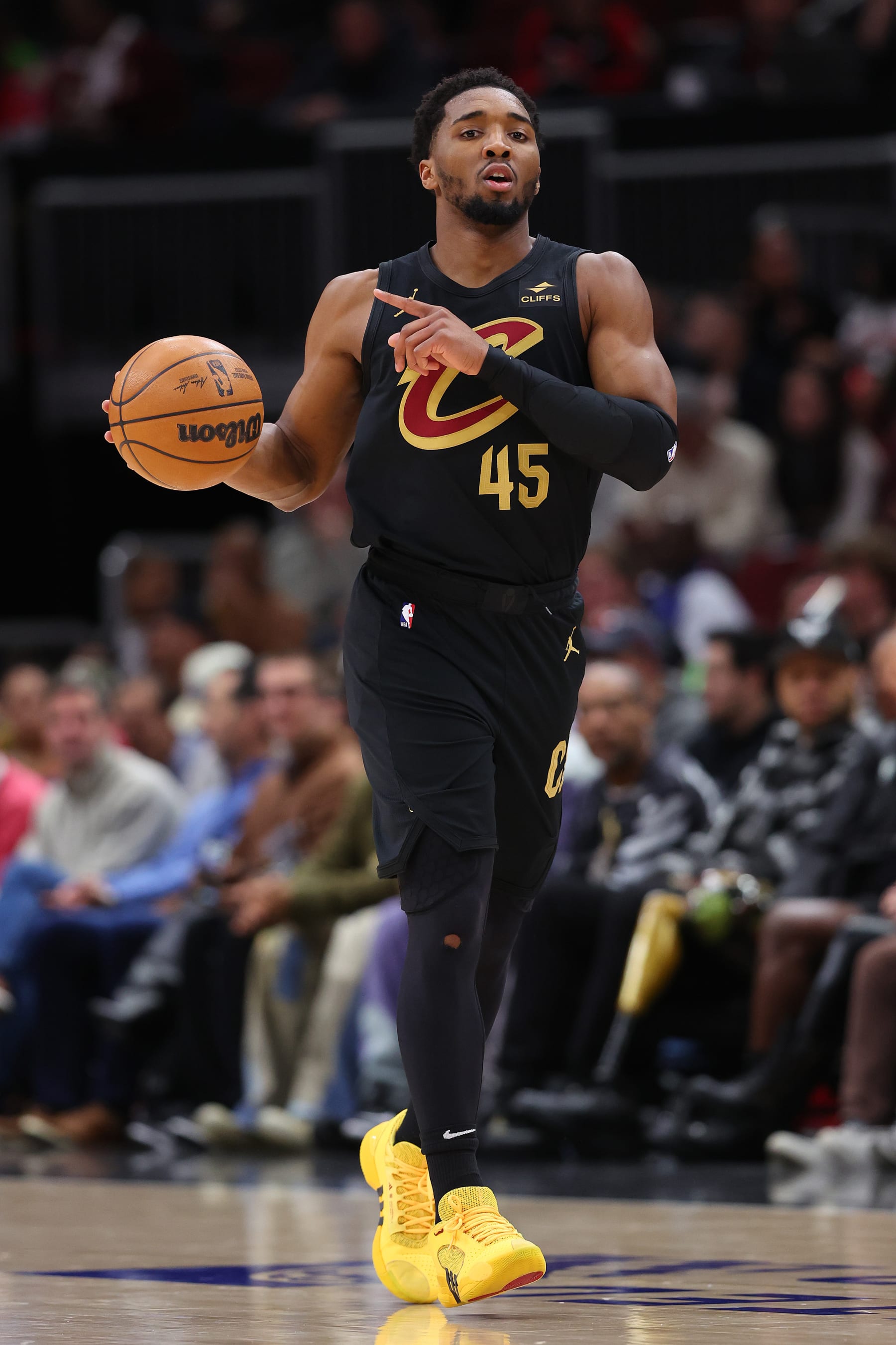 CHICAGO, ILLINOIS - FEBRUARY 28: Donovan Mitchell #45 of the Cleveland Cavaliers dribbles against the Chicago Bulls during the first half at the United Center on February 28, 2024 in Chicago, Illinois. NOTE TO USER: User expressly acknowledges and agrees that, by downloading and or using this photograph, User is consenting to the terms and conditions of the Getty Images License Agreement. (Photo by Michael Reaves/Getty Images)