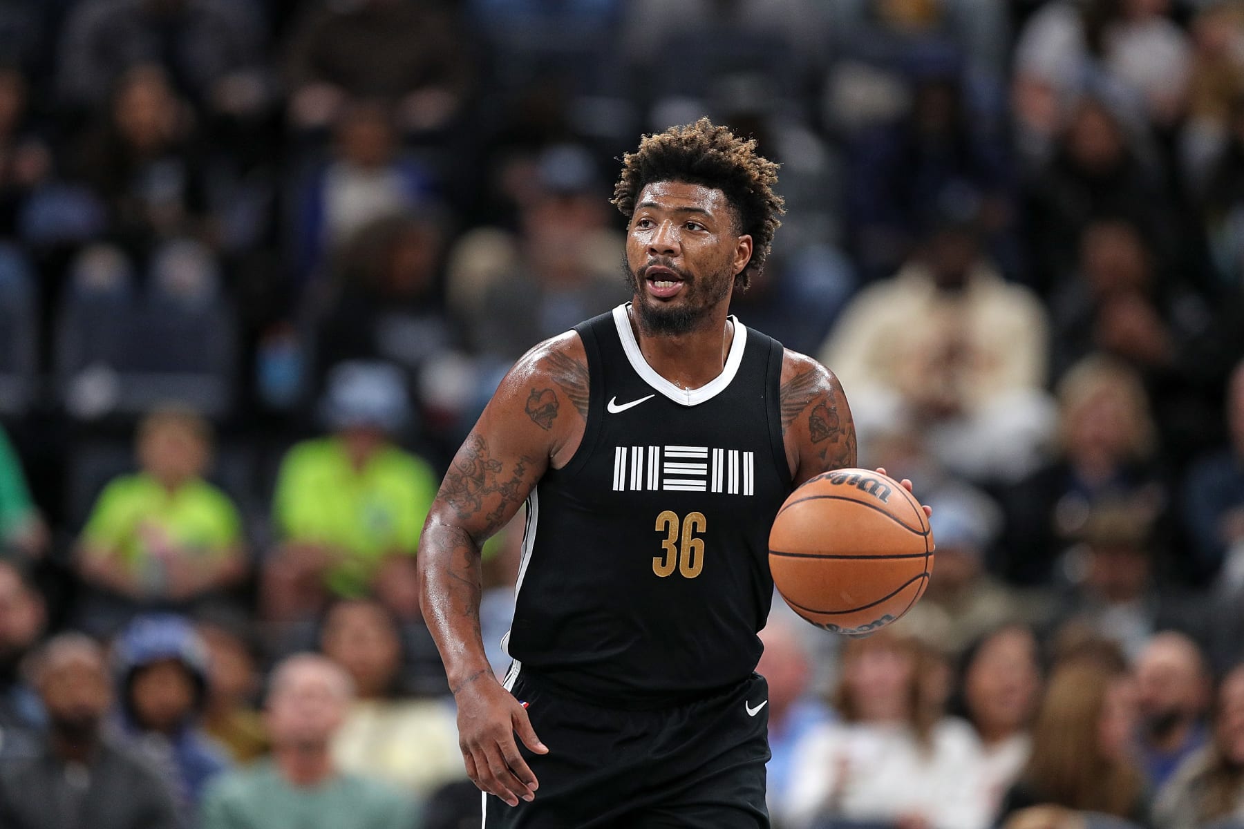 MEMPHIS, TENNESSEE - NOVEMBER 10: Marcus Smart #36 of the Memphis Grizzlies brings the ball up court during the game against the Utah Jazz at FedExForum on November 10, 2023 in Memphis, Tennessee. NOTE TO USER: User expressly acknowledges and agrees that, by downloading and or using this photograph, User is consenting to the terms and conditions of the Getty Images License Agreement. (Photo by Justin Ford/Getty Images)