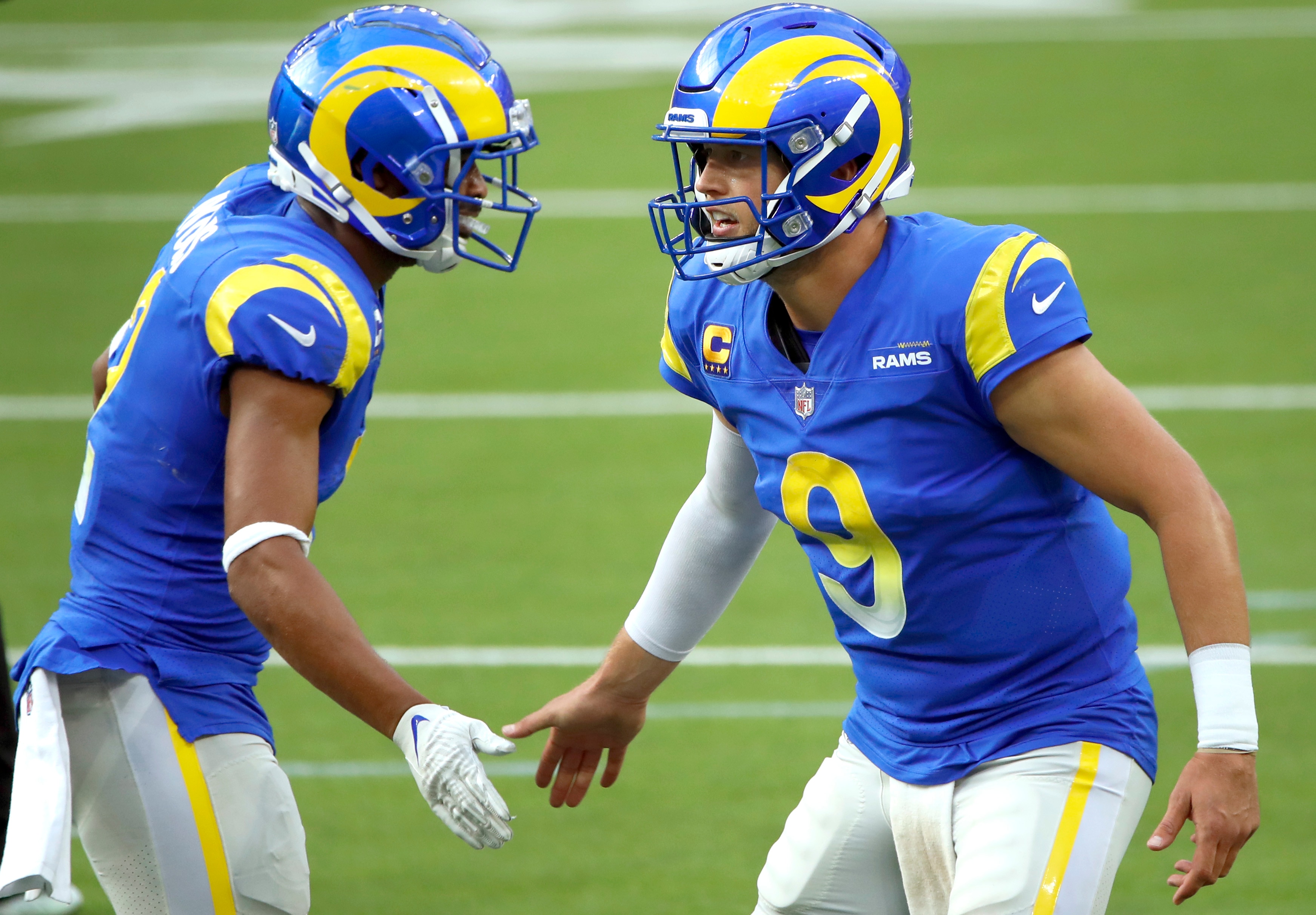 INGLEWOOD, CALIFORNIA - OCTOBER 24: Matthew Stafford #9 of the Los Angeles Rams celebrates a 2-point conversion with Robert Woods #2 during the fourth quarter in the game against the Detroit Lions at SoFi Stadium on October 24, 2021 in Inglewood, California. (Photo by Katelyn Mulcahy/Getty Images)