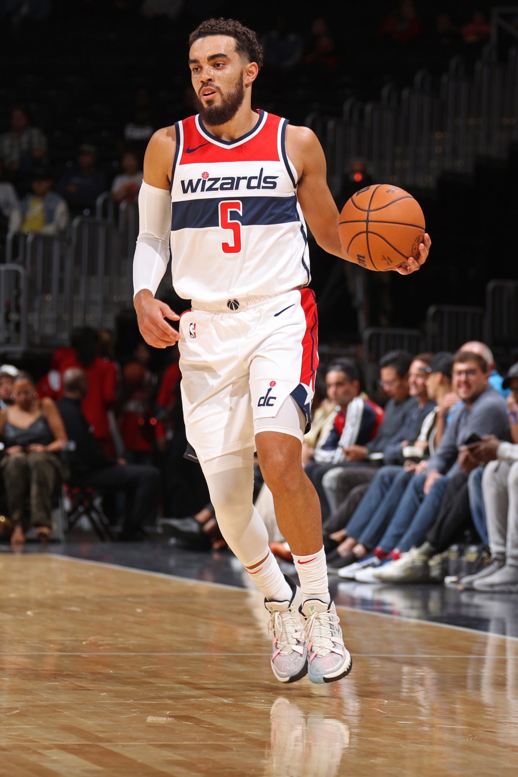 WASHINGTON, DC -  OCTOBER 12: Tyus Jones #5 of the Washington Wizards dribbles the ball during the game against the Charlotte Hornets on October 12, 2023 at Capital One Arena in Washington, DC. NOTE TO USER: User expressly acknowledges and agrees that, by downloading and or using this Photograph, user is consenting to the terms and conditions of the Getty Images License Agreement. Mandatory Copyright Notice: Copyright 2023 NBAE (Photo by Stephen Gosling/NBAE via Getty Images)