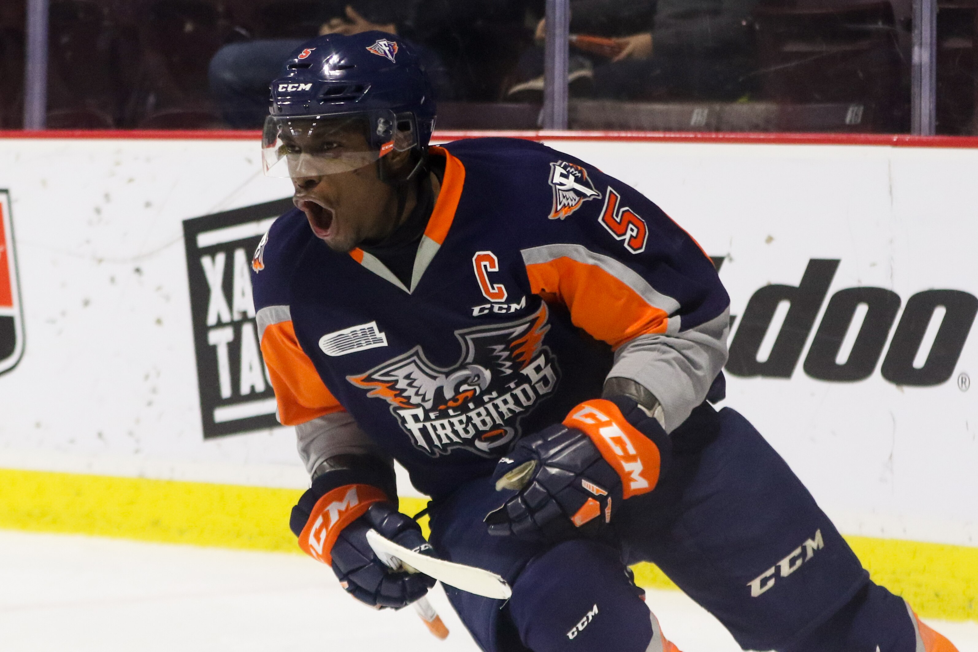 WINDSOR, ON - DECEMBER 03: Defenseman Jalen Smereck #5 of the Flint Firebirds celebrates his game winning overtime goal against the Windsor Spitfires on December 3, 2017 at the WFCU Centre in Windsor, Ontario, Canada. (Photo by Dennis Pajot/Getty Images)
