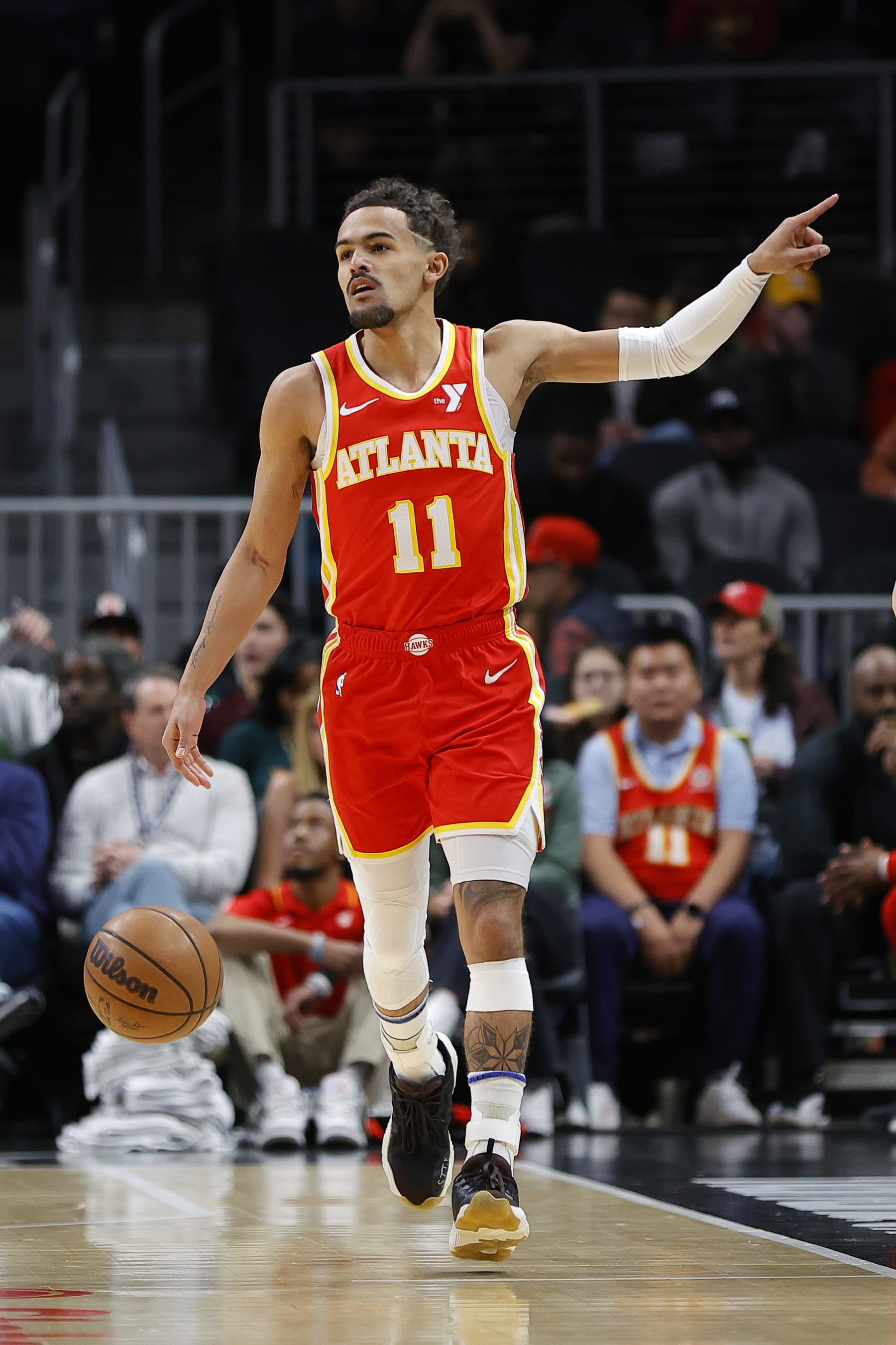 ATLANTA, GEORGIA - JANUARY 28: Trae Young #11 of the Atlanta Hawks gestures during the first half against the Toronto Raptors at State Farm Arena on January 28, 2024 in Atlanta, Georgia. NOTE TO USER: User expressly acknowledges and agrees that, by downloading and or using this photograph, User is consenting to the terms and conditions of the Getty Images License Agreement. (Photo by Alex Slitz/Getty Images)