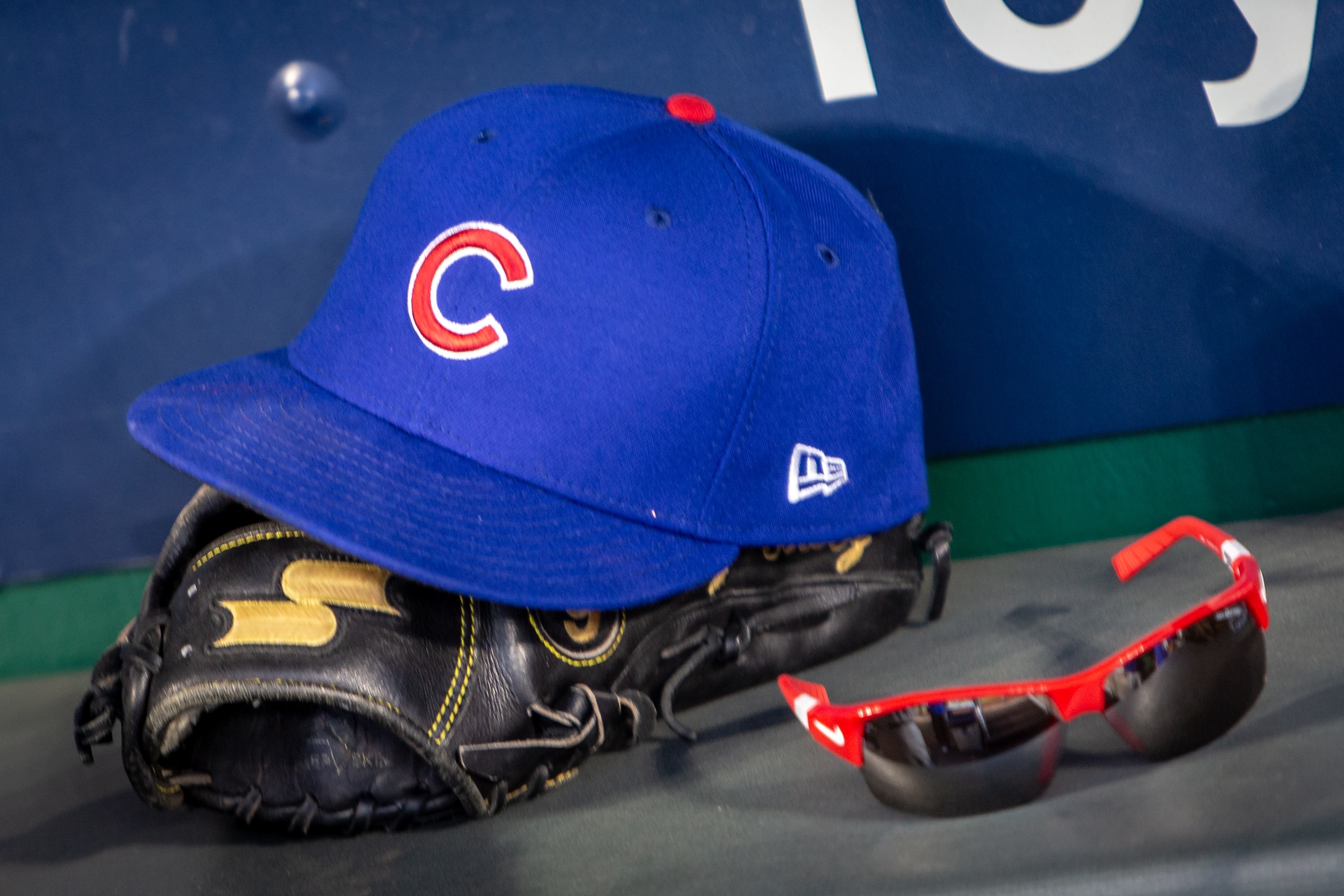 KANSAS CITY, MO - AUGUST 06: Chicago Cubs hat and glove in the dugout during the Major League Baseball inter-league game against the Kansas City Royals on August 6, 2018 at Kauffman Stadium in Kansas City, Missouri. (Photo by William Purnell/Icon Sportswire via Getty Images)