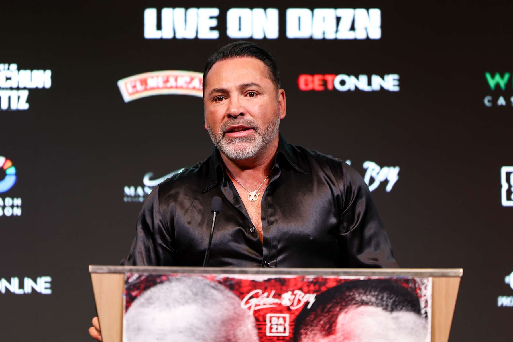 LAS VEGAS, NEVADA - AUGUST 08: Oscar De La Hoya speaks on stage during a press conference at Mandalay Bay Resort and Casino on August 08, 2024 in Las Vegas, Nevada. (Photo by Cris Esqueda/Golden Boy/Getty Images)