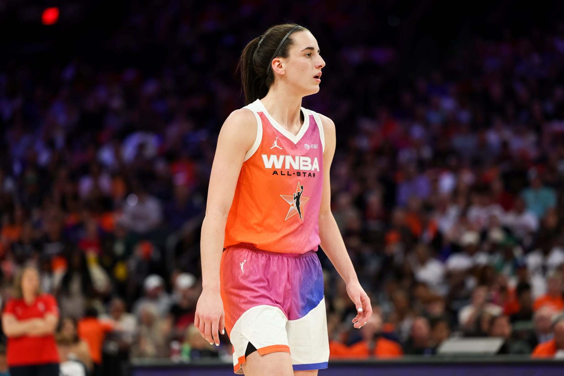 PHOENIX, AZ - JULY 20: Caitlin Clark #22 of Team WNBA looks on during the 2024 WNBA All Star Game at Footprint Center on July 20, 2024 in Phoenix, Arizona. NOTE TO USER: User expressly acknowledges and agrees that, by downloading and/or using this Photograph, user is consenting to the terms and conditions of the Getty Images License Agreement. Mandatory Copyright Notice: Copyright 2024 NBAE (Photo by Dylan Goodman/NBAE via Getty Images)
