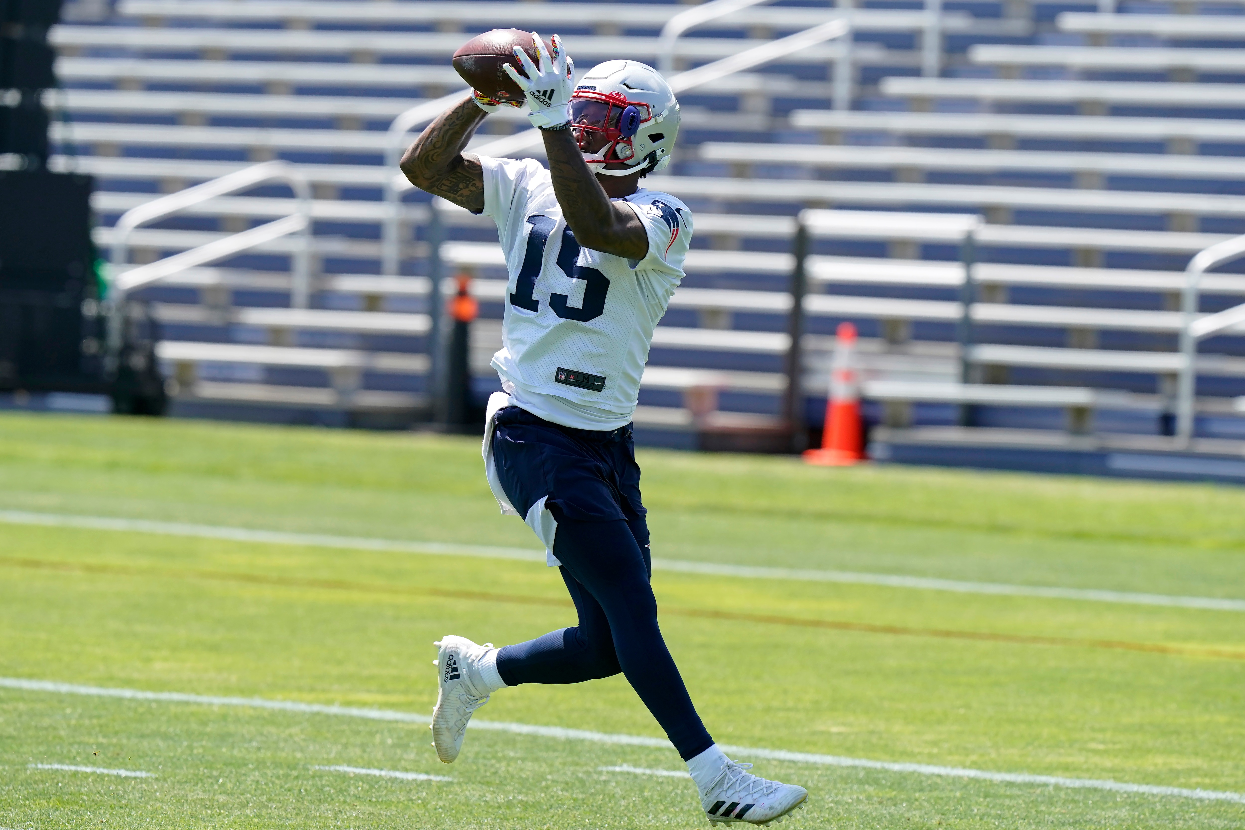 New England Patriots wide receiver N'Keal Harry (15) makes a catch during an NFL football practice in Foxborough, Mass., Thursday, May 27, 2021. (AP Photo/Steven Senne)