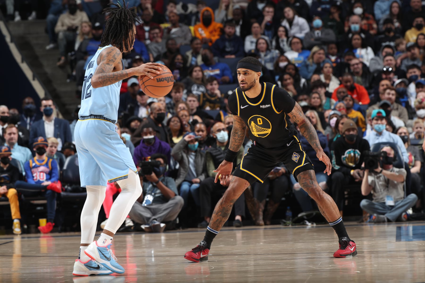 MEMPHIS, TN - JANUARY 11: Gary Payton II #0 of the Golden State Warriors defends the ball against Ja Morant #12 of the Memphis Grizzlies on January 11, 2022 at FedExForum in Memphis, Tennessee. NOTE TO USER: User expressly acknowledges and agrees that, by downloading and or using this photograph, User is consenting to the terms and conditions of the Getty Images License Agreement. Mandatory Copyright Notice: Copyright 2022 NBAE (Photo by Joe Murphy/NBAE via Getty Images)
