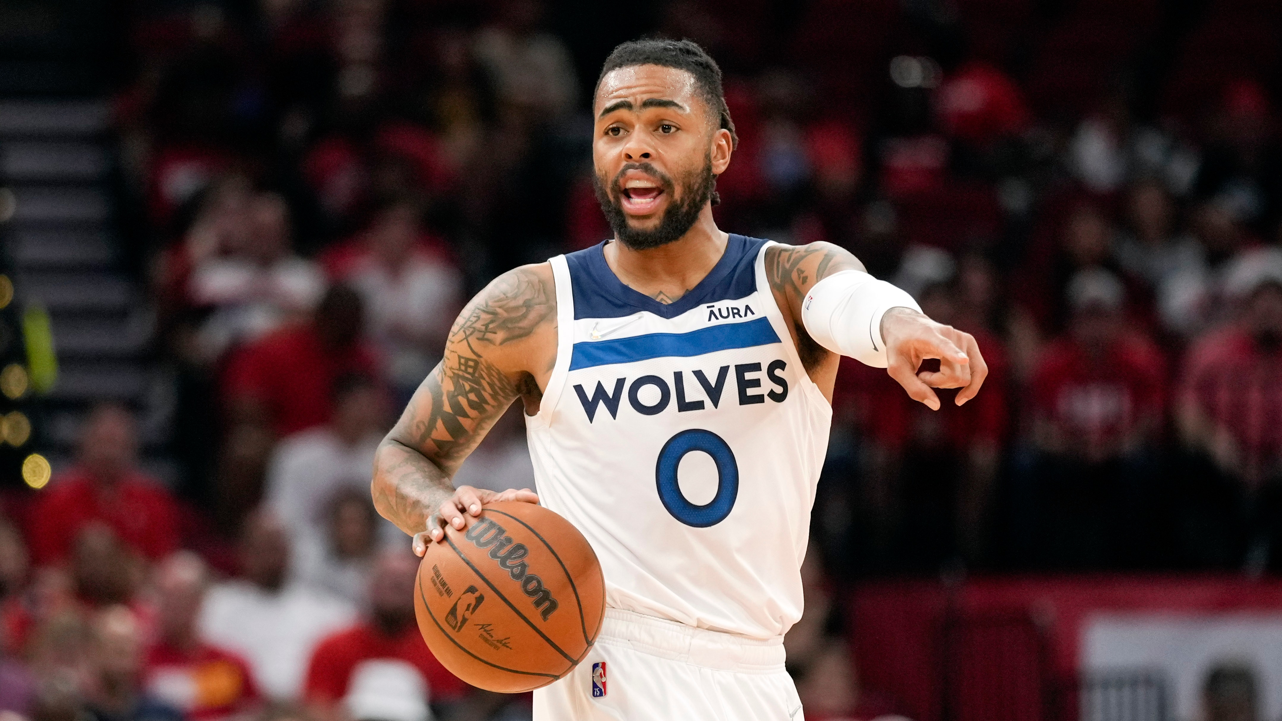 Minnesota Timberwolves guard D'Angelo Russell dribbles during the first half of an NBA basketball game against the Houston Rockets, Sunday, April 3, 2022, in Houston. (AP Photo/Eric Christian Smith)