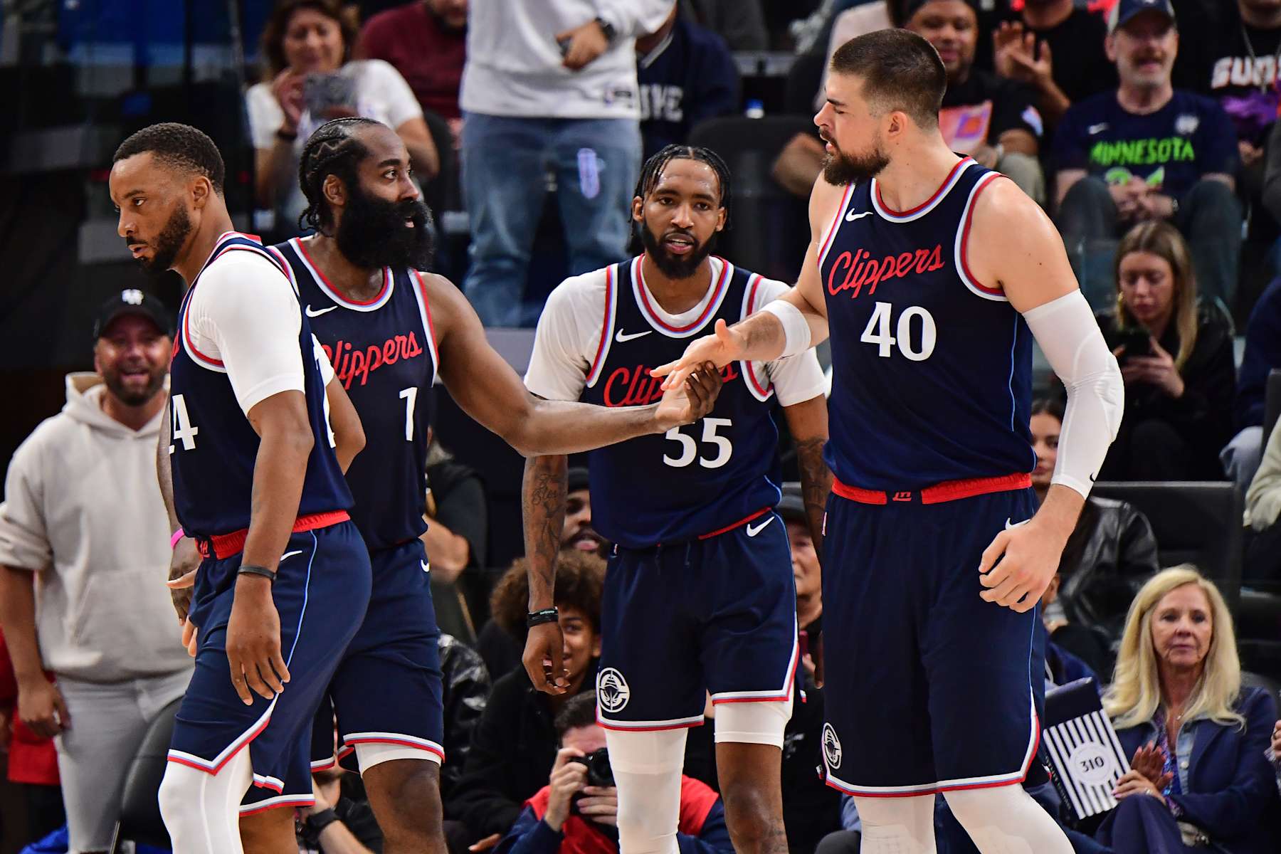 INGLEWOOD, CA - OCTOBER 23: James Harden #1 and Ivica Zubac #40 of the LA Clippers high five during the game against the Phoenix Suns on October 23, 2024 at Intuit Dome in Los Angeles, California. NOTE TO USER: User expressly acknowledges and agrees that, by downloading and/or using this Photograph, user is consenting to the terms and conditions of the Getty Images License Agreement. Mandatory Copyright Notice: Copyright 2024 NBAE (Photo by Adam Pantozzi/NBAE via Getty Images)