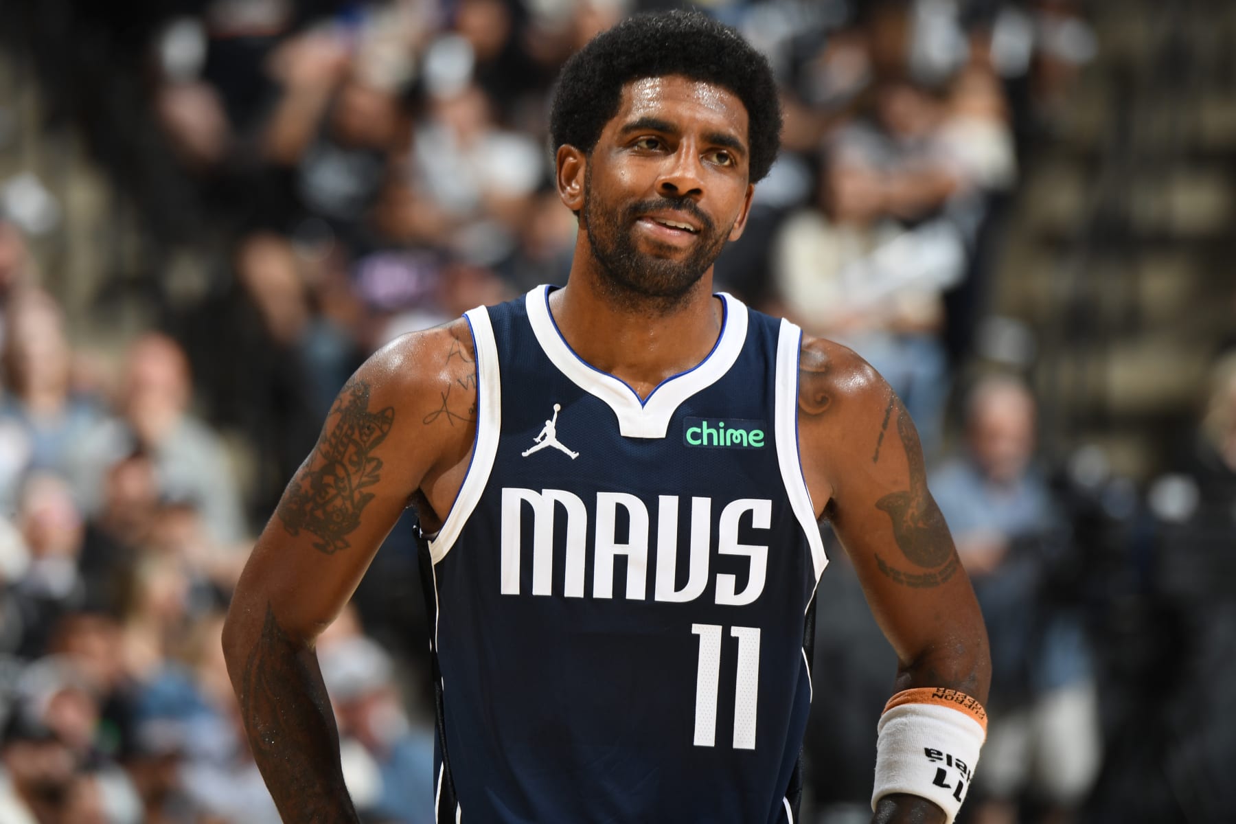SAN ANTONIO, TX - OCTOBER 25: Kyrie Irving #11 of the Dallas Mavericks smiles during the game against the San Antonio Spurs on October 25, 2023 at the Frost Bank Center in San Antonio, Texas. NOTE TO USER: User expressly acknowledges and agrees that, by downloading and or using this photograph, user is consenting to the terms and conditions of the Getty Images License Agreement. Mandatory Copyright Notice: Copyright 2023 NBAE (Photos by Andrew D. Bernstein/NBAE via Getty Images)
