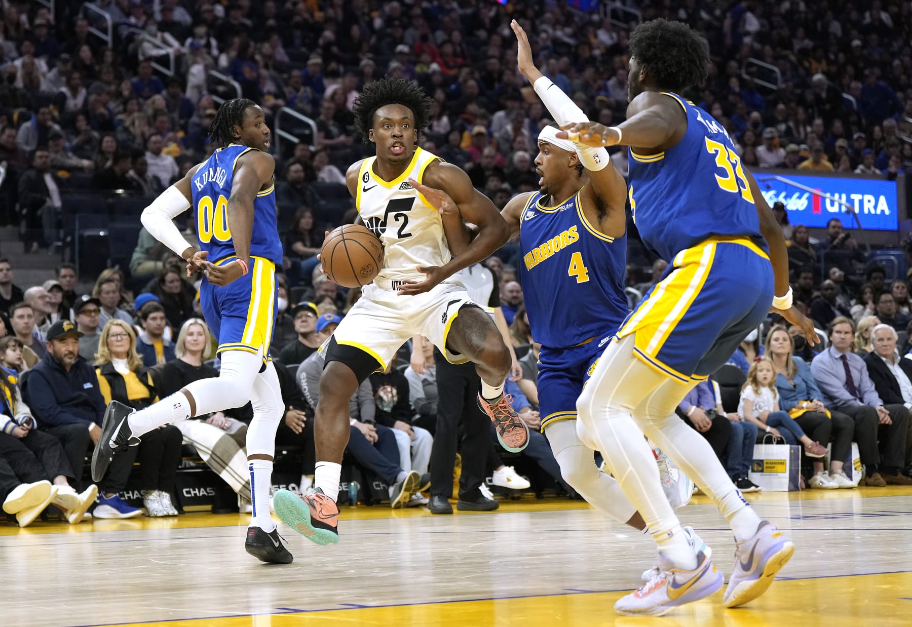 SAN FRANCISCO, CALIFORNIA - DECEMBER 28: Collin Sexton #2 of the Utah Jazz handling the ball gets triple teamed by Jonathan Kuminga #00, Moses Moody #4 and James Wiseman during the third quarter at Chase Center on December 28, 2022 in San Francisco, California. NOTE TO USER: User expressly acknowledges and agrees that, by downloading and or using this photograph, User is consenting to the terms and conditions of the Getty Images License Agreement. (Photo by Thearon W. Henderson/Getty Images)