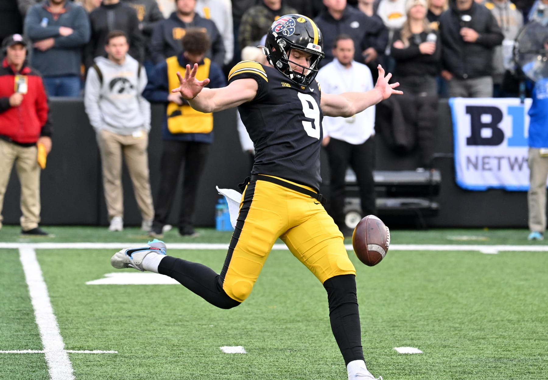 IOWA CITY, IA - NOVEMBER 11: Iowa Hawkeyes punter Tory Taylor (9) punts during a college football game between the Rutgers Scarlet Knights and the Iowa Hawkeyes on November 11, 2023, at Kinnick Stadium in Iowa City, IA. (Photo by Keith Gillett/Icon Sportswire via Getty Images)