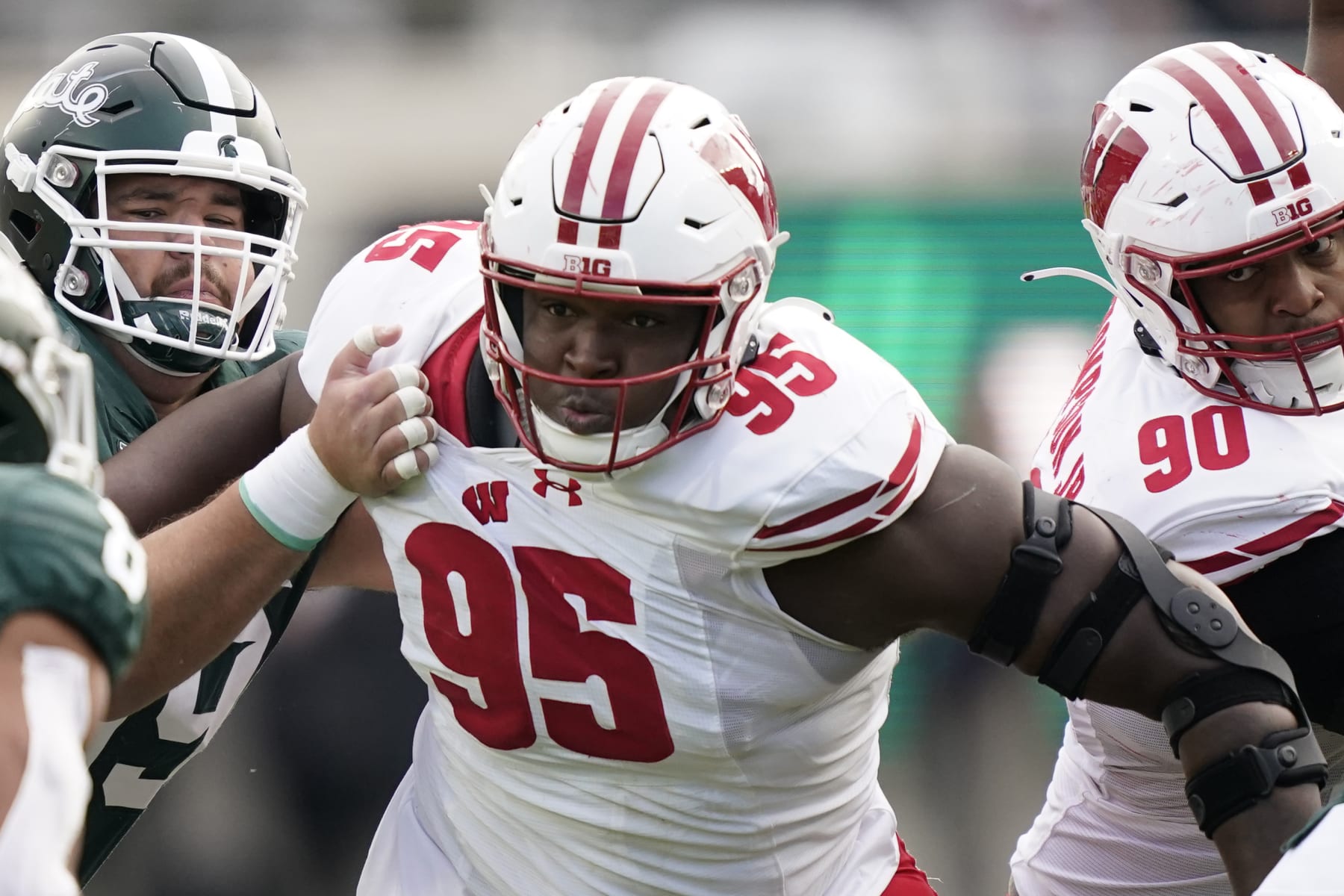 Wisconsin nose tackle Keeanu Benton plays during the first half of an NCAA college football game against Michigan State, Saturday, Oct. 15, 2022, in East Lansing, Mich. (AP Photo/Carlos Osorio)