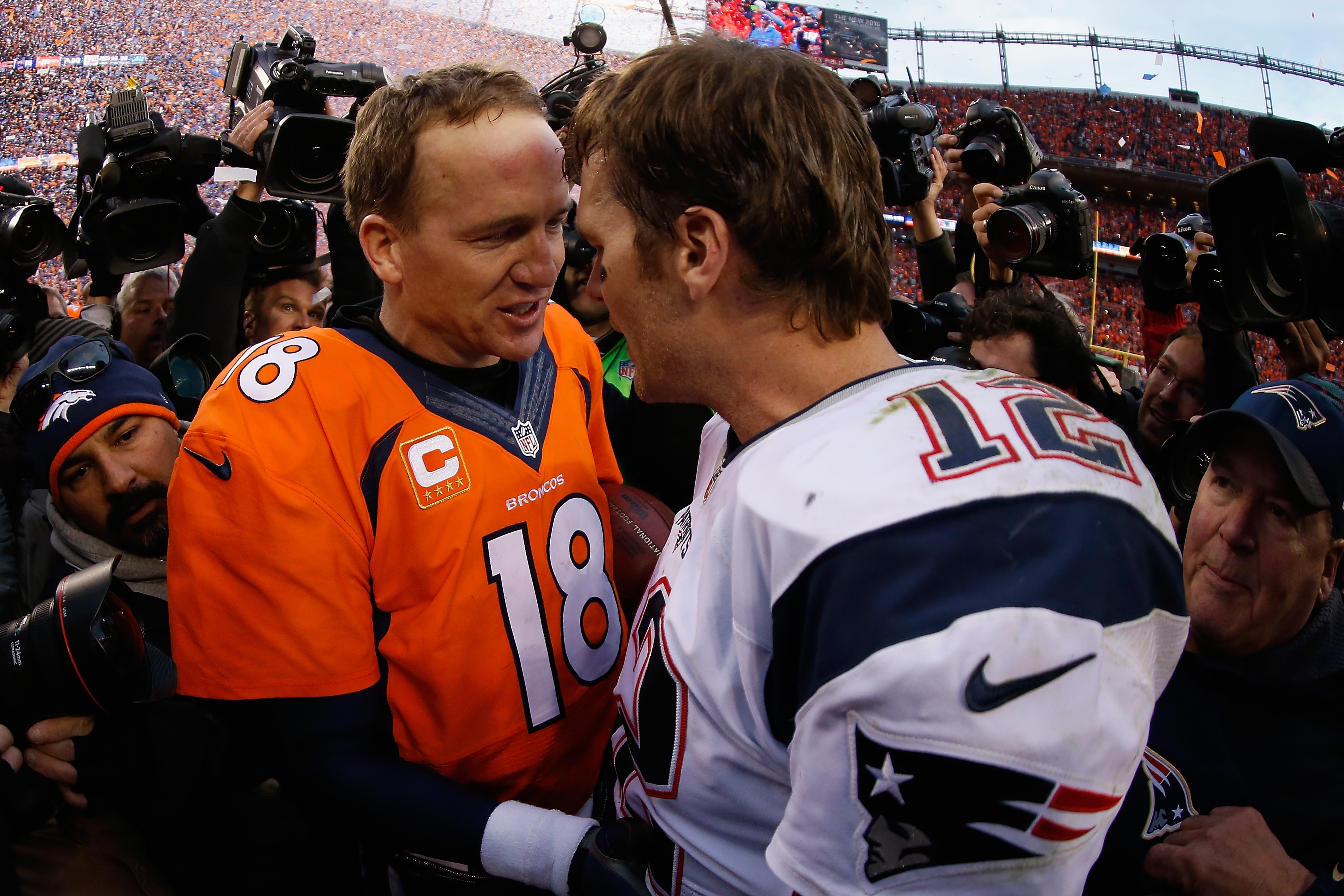 DENVER, CO - JANUARY 24:  Quarterbacks Peyton Manning #18 of the Denver Broncos and Tom Brady #12 of the New England Patriots shake hands following the AFC Championship game at Sports Authority Field at Mile High on January 24, 2016 in Denver, Colorado. The Broncos defeated the Patriots 20-18.  (Photo by Christian Petersen/Getty Images)