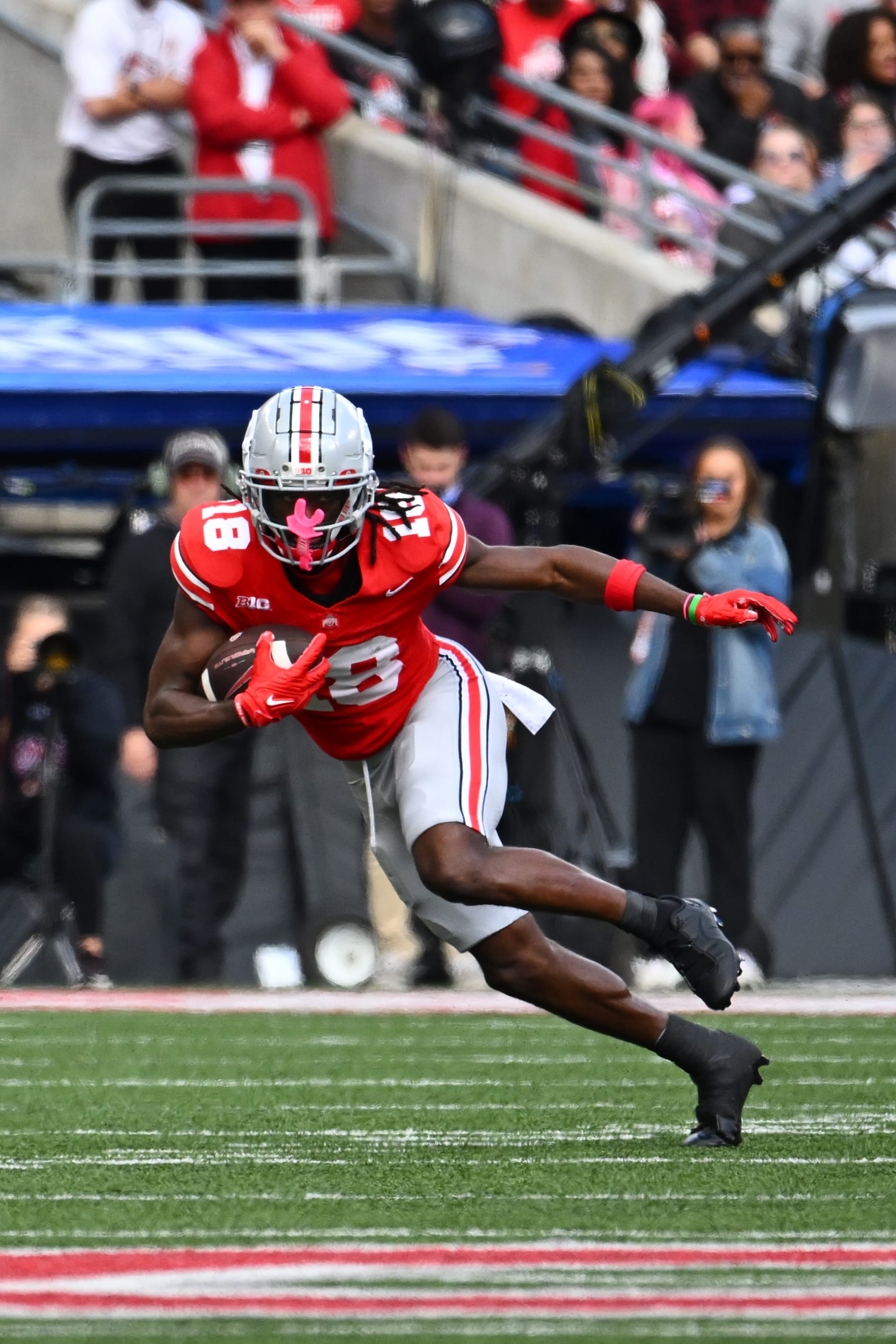 COLUMBUS, OHIO - OCTOBER 07: Marvin Harrison Jr. #18 of the Ohio State Buckeyes runs with the ball during a game against the Maryland Terrapins at Ohio Stadium on October 07, 2023 in Columbus, Ohio. (Photo by Ben Jackson/Getty Images)