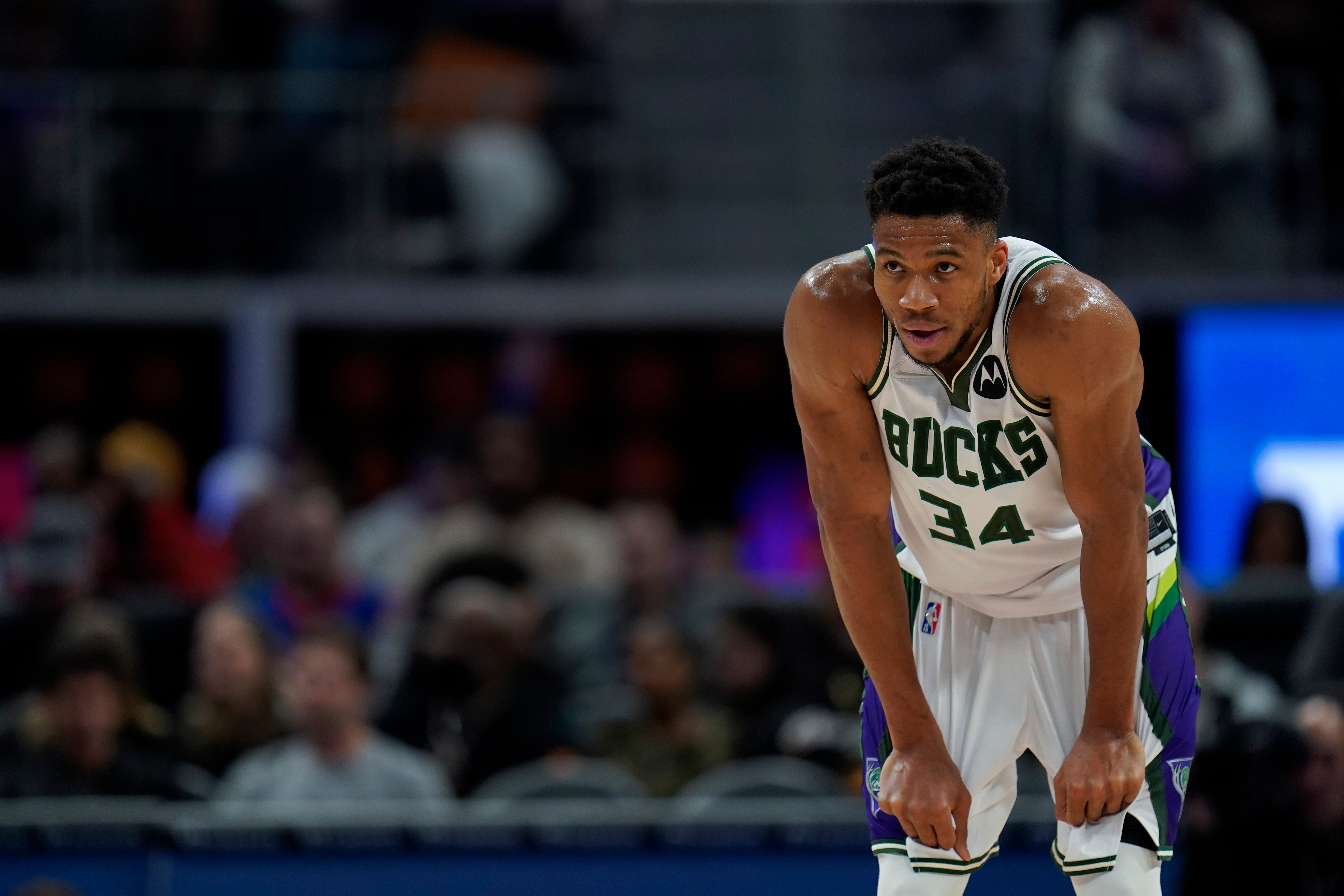 Milwaukee Bucks forward Giannis Antetokounmpo plays against the Detroit Pistons in the first half of an NBA basketball game in Detroit, Friday, April 8, 2022. (AP Photo/Paul Sancya)