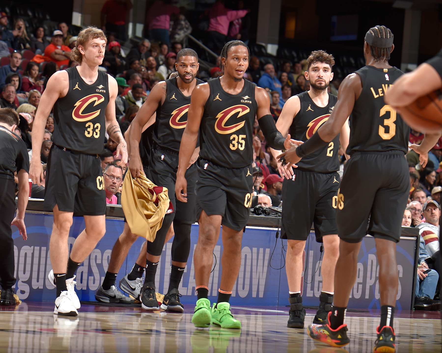 CLEVELAND, OH - NOVEMBER 1: Isaac Okoro #35 of the Cleveland Cavaliers high fives Caris LeVert #3 during the game against the Orlando Magic on November 1, 2024 at Rocket Mortgage FieldHouse in Cleveland, Ohio. NOTE TO USER: User expressly acknowledges and agrees that, by downloading and/or using this Photograph, user is consenting to the terms and conditions of the Getty Images License Agreement. Mandatory Copyright Notice: Copyright 2024 NBAE (Photo by David Liam Kyle/NBAE via Getty Images)