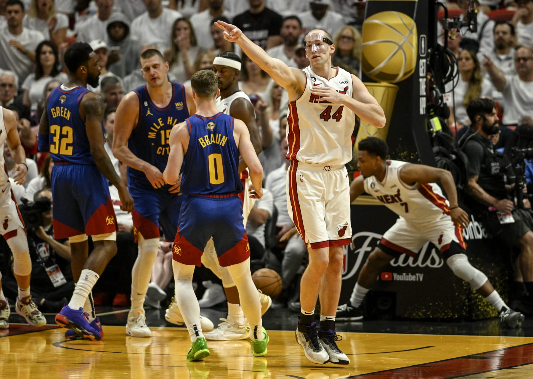 MIAMI, FL - JUNE 7: Cody Zeller (44) of the Miami Heat points towards his team's offensive end after Nikola Jokic (15) of the Denver Nuggets turned the ball over on a play unrelated to the contributions of the masked Miami big man in the third quarter of the Nuggets' 104-94 win during Game 3 of the NBA Finals at the Kaseya Center in Miami on Wednesday, June 7, 2023. (Photo by AAron Ontiveroz/The Denver Post)