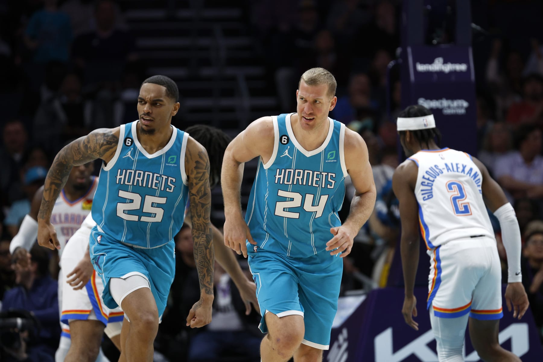 CHARLOTTE, NORTH CAROLINA - DECEMBER 29: P.J. Washington #25 and Mason Plumlee #24 of the Charlotte Hornets react following a play during the second half of the game against the Oklahoma City Thunder at Spectrum Center on December 29, 2022 in Charlotte, North Carolina. NOTE TO USER: User expressly acknowledges and agrees that, by downloading and or using this photograph, User is consenting to the terms and conditions of the Getty Images License Agreement. (Photo by Jared C. Tilton/Getty Images)