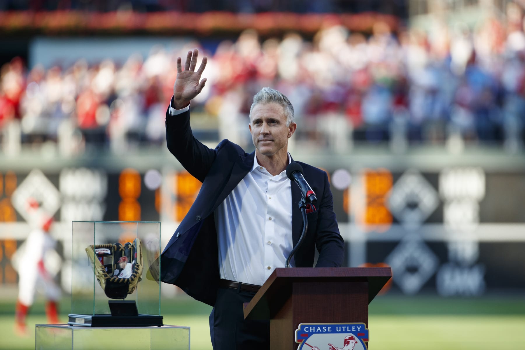 Former Philadelphia Phillies' Chase Utley reacts during a retirement ceremony before a baseball game between the Philadelphia Phillies and the Miami Marlins, Friday, June 21, 2019, in Philadelphia. Miami won 2-1. (AP Photo/Matt Slocum)