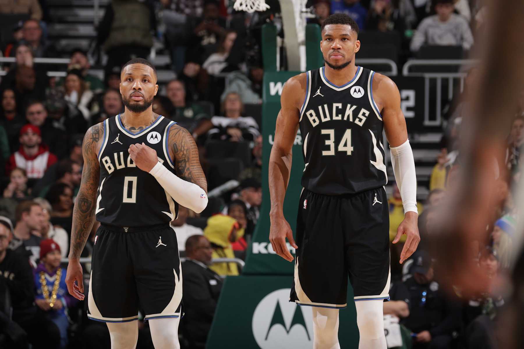 MILWAUKEE, WI - JANUARY 19:  Damian Lillard #0 of the Milwaukee Bucks and Giannis Antetokounmpo #34 of the Milwaukee Bucks looks on during the game against the Philadelphia 76ers on January 19, 2025 at Fiserv Forum Center in Milwaukee, Wisconsin. NOTE TO USER: User expressly acknowledges and agrees that, by downloading and or using this Photograph, user is consenting to the terms and conditions of the Getty Images License Agreement. Mandatory Copyright Notice: Copyright 2025 NBAE (Photo by Gary Dineen/NBAE via Getty Images).