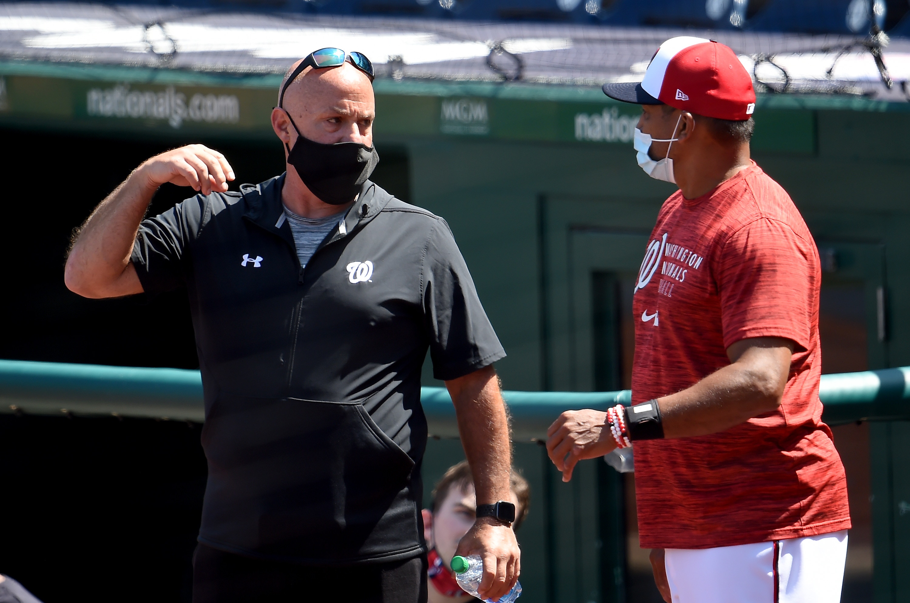 WASHINGTON, DC - APRIL 5: Manager Dave Martinez of the Washington Nationals talks to general manager Mike Rizzo during a workout at Nationals Park on April 05, 2021 in Washington, DC. (Photo by Greg Fiume/Getty Images)