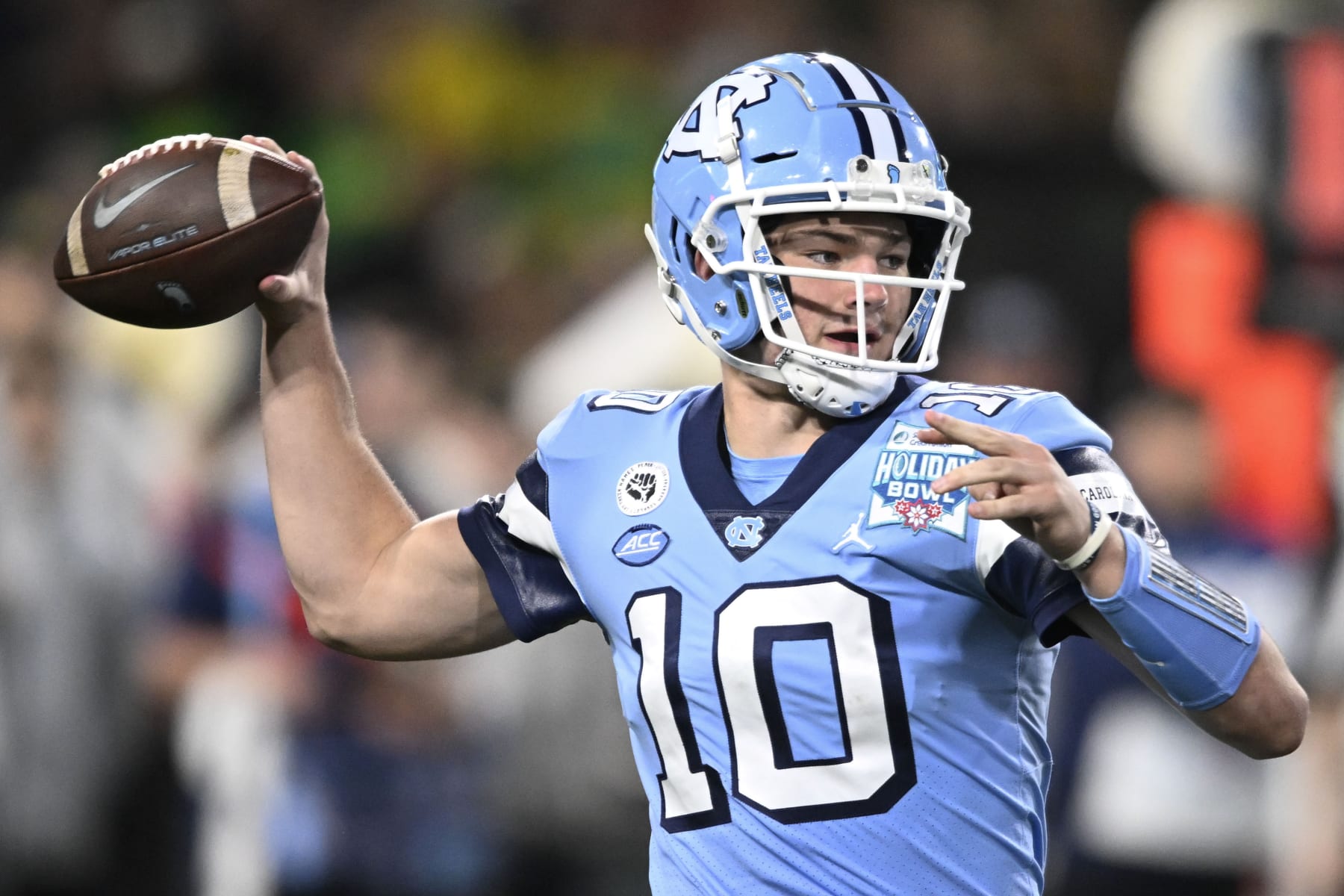 FILE - North Carolina quarterback Drake Maye (10) passes during the first half of the Holiday Bowl NCAA college football game against Oregon Wednesday, Dec. 28, 2022, in San Diego. Maye rocketed to stardom in his first season as North Carolina’s starting quarterback, suddenly becoming a talked-about NFL prospect and Heisman Trophy candidate. He starts this season facing those expectations from the opening snap, including making the Tar Heels an Atlantic Coast Conference contender. (AP Photo/Denis Poroy, File)