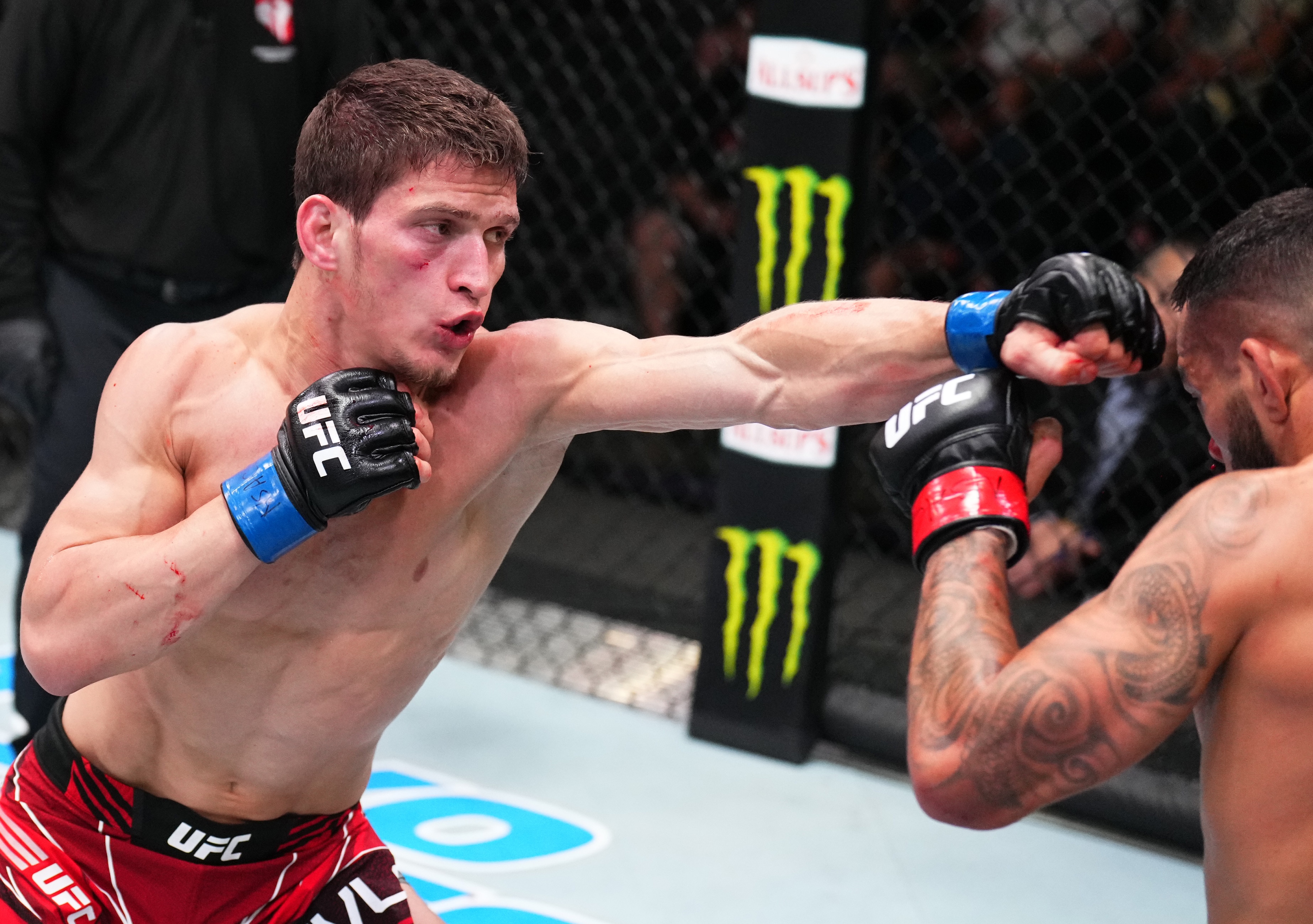 LAS VEGAS, NEVADA - JUNE 04: (L-R) Movsar Evloev of Russia punches Dan Ige in a featherweight fight during the UFC Fight Night event at UFC APEX on June 04, 2022 in Las Vegas, Nevada. (Photo by Chris Unger/Zuffa LLC)