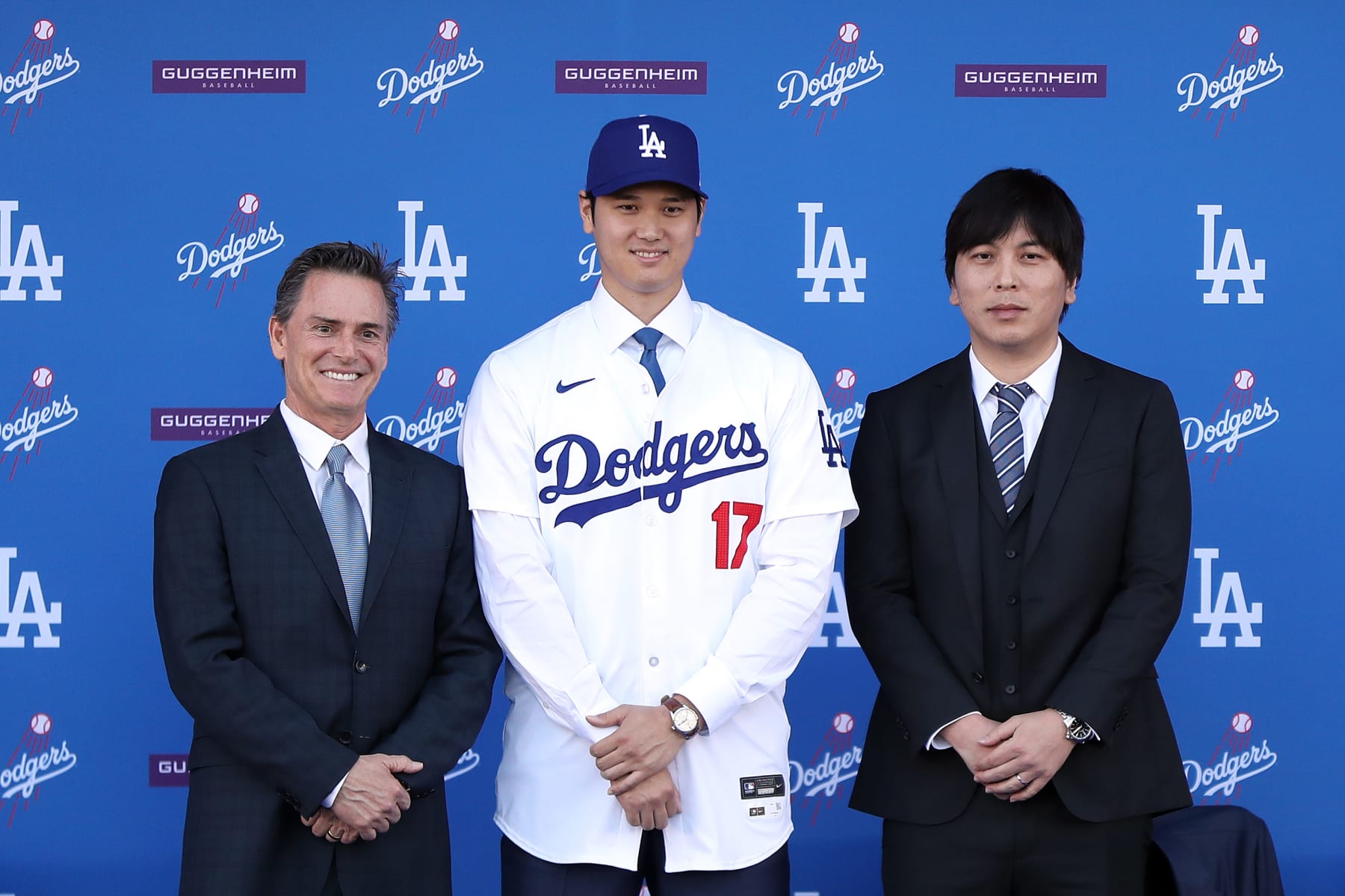 LOS ANGELES, CALIFORNIA - DECEMBER 14: Shohei Ohtani poses for a photo with his interpreter Ippei Mizuhara (R) and agent Nez Balelo (L) after being introduced by the Los Angeles Dodgers at Dodger Stadium on December 14, 2023 in Los Angeles, California. (Photo by Meg Oliphant/Getty Images)