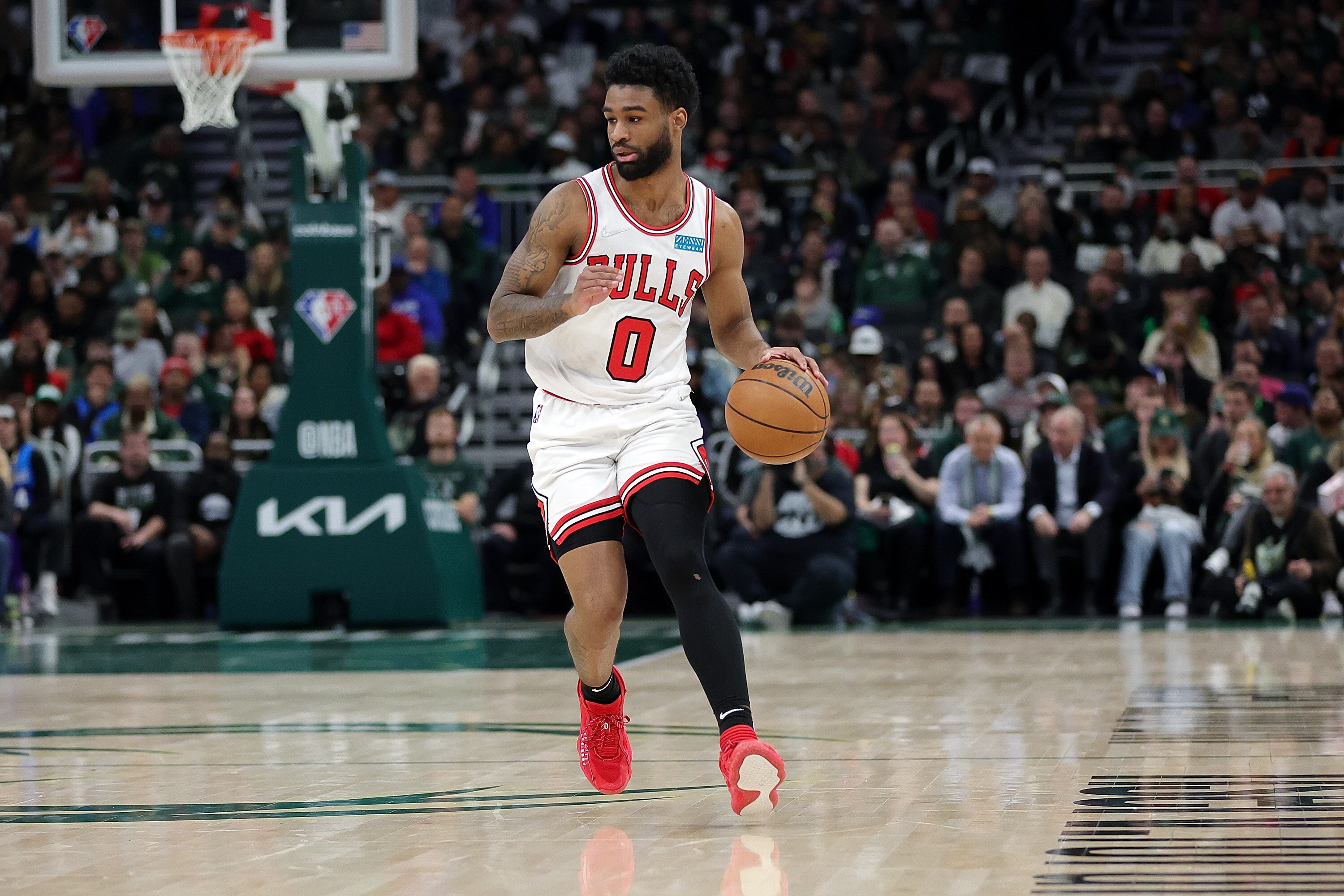 MILWAUKEE, WISCONSIN - APRIL 27: Coby White #0 of the Chicago Bulls handles the ball during Game Five of the Eastern Conference First Round Playoffs against the Milwaukee Bucks at Fiserv Forum on April 27, 2022 in Milwaukee, Wisconsin. NOTE TO USER: User expressly acknowledges and agrees that, by downloading and or using this photograph, User is consenting to the terms and conditions of the Getty Images License Agreement. (Photo by Stacy Revere/Getty Images)