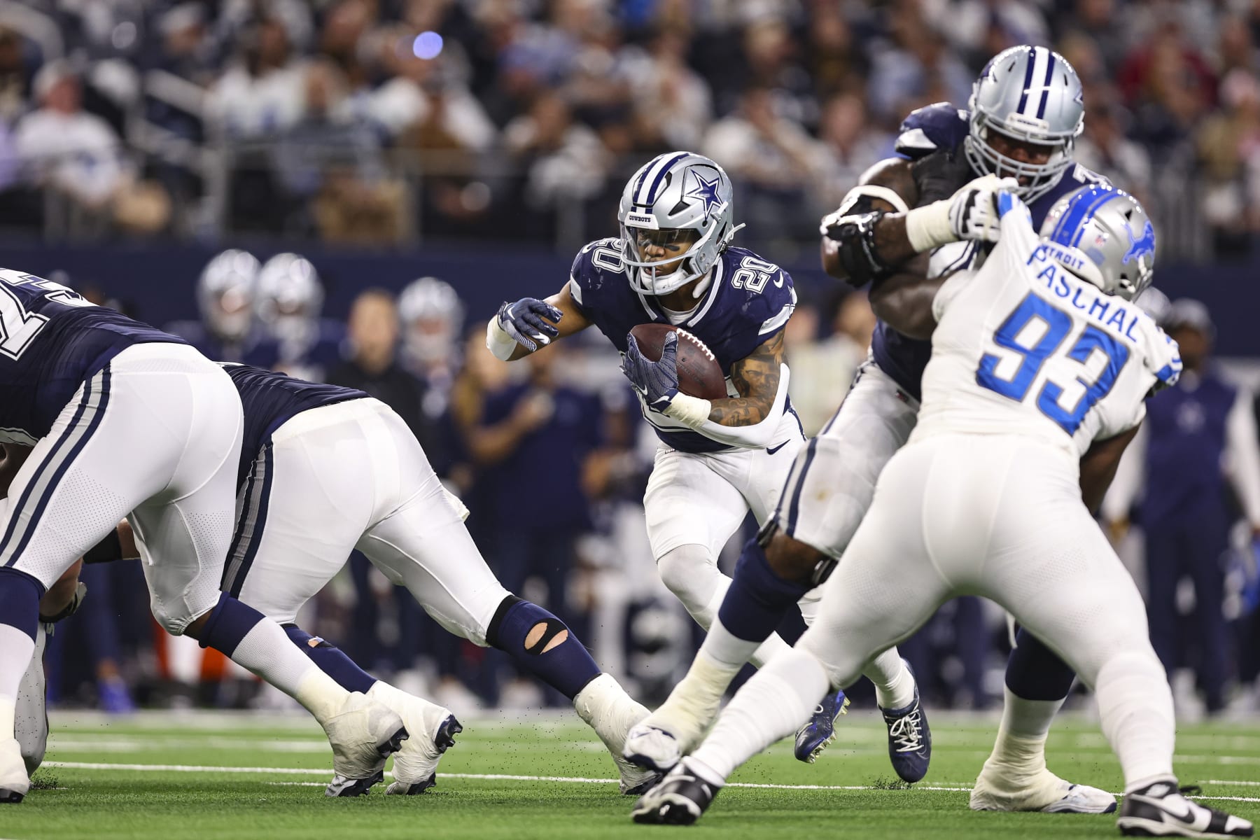 ARLINGTON, TX - DECEMBER 30: Tony Pollard #20 of the Dallas Cowboys runs the ball during an NFL football game against the Detroit Lions at AT&T Stadium on December 30, 2023 in Arlington, Texas. (Photo by Perry Knotts/Getty Images)
